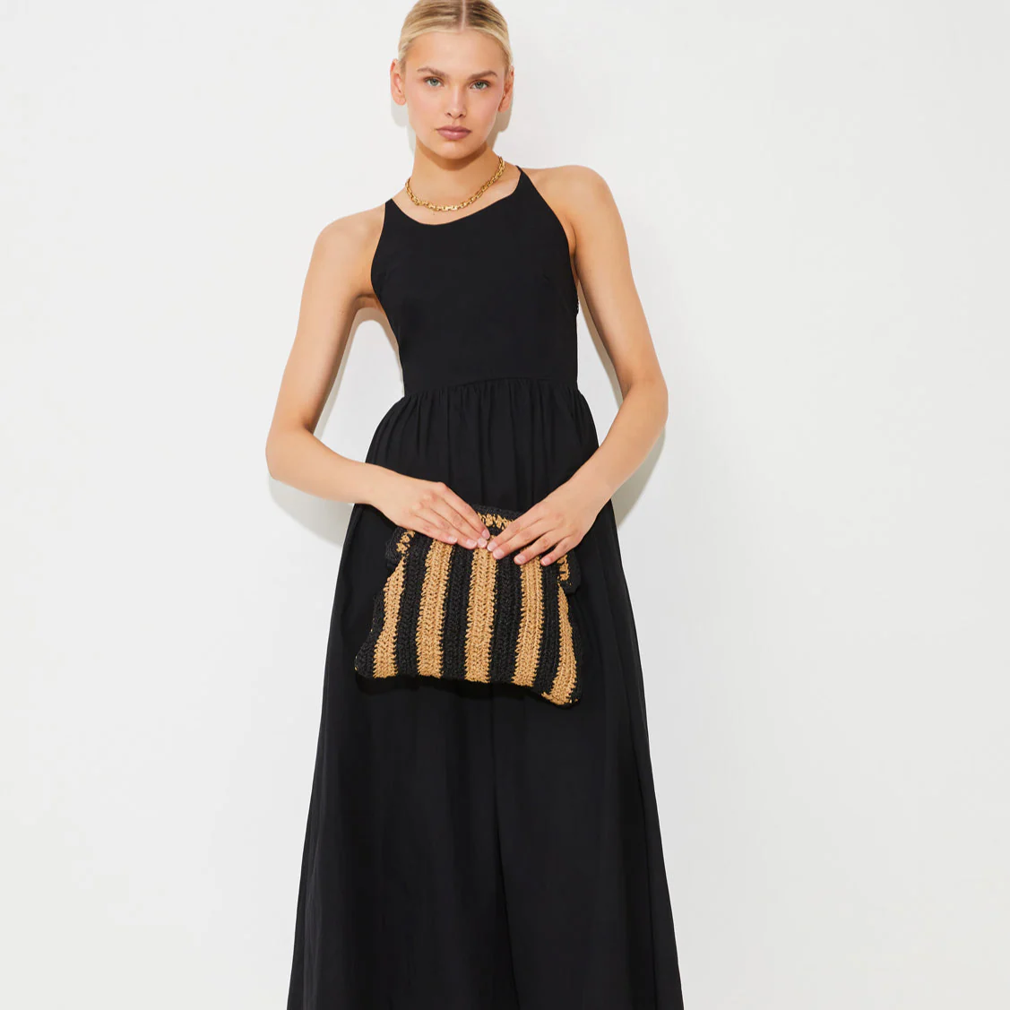 Effortless Summer Style with our Raffia Striped Pouch Bag