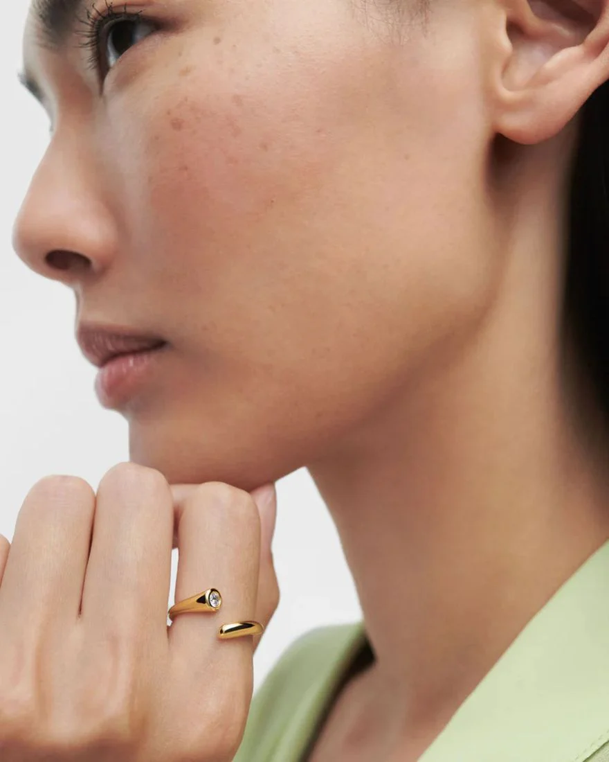 Anello PdPaola dorato aperto linee fluenti con pietra bianca AN01-D69