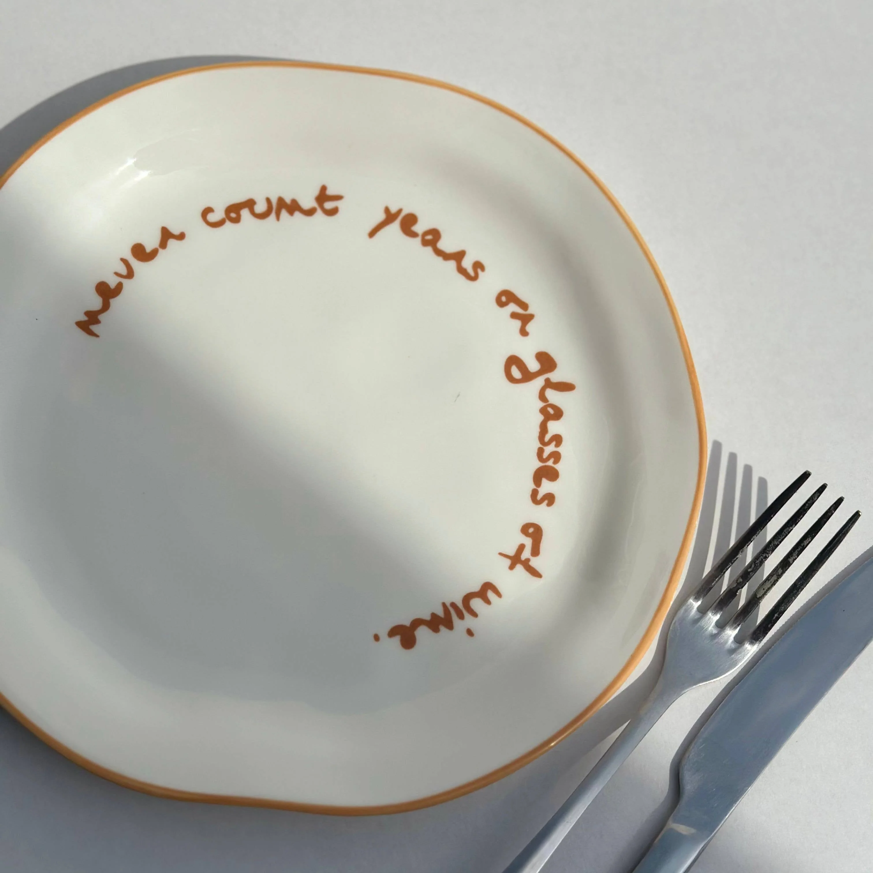 Statement Lunch Plate �C ��Never Count Years or Glasses of Wine��