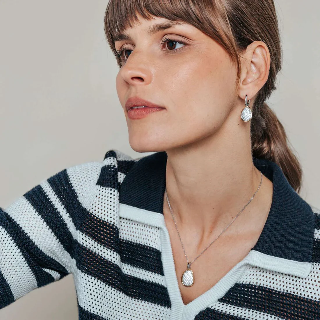 Orecchini Ti Sento Milano bicolore con forma a ciottolo e zirconi 78027ZY