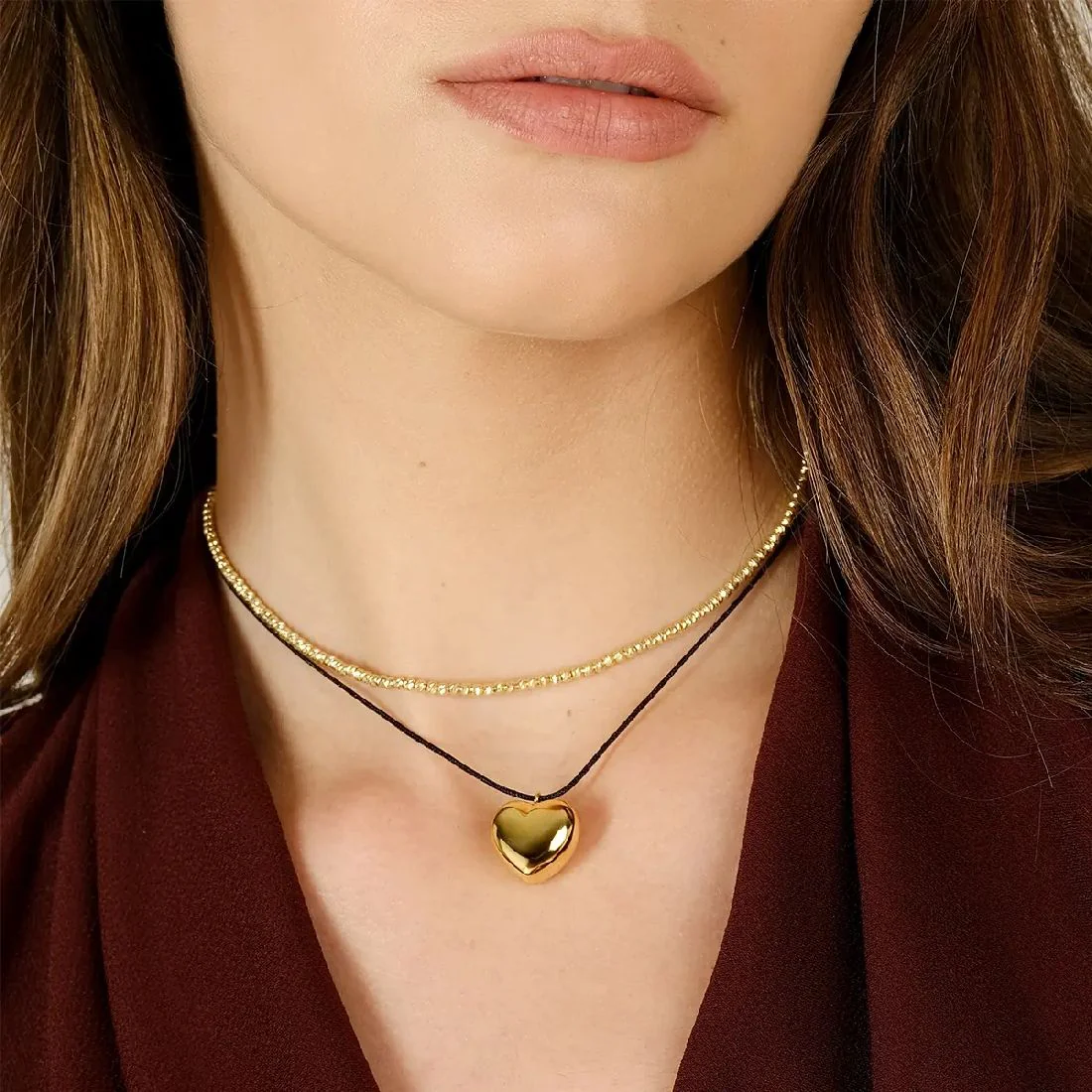 Collana Amen con pendente dorato a cuore e cordino nero CLCOCUBONG3