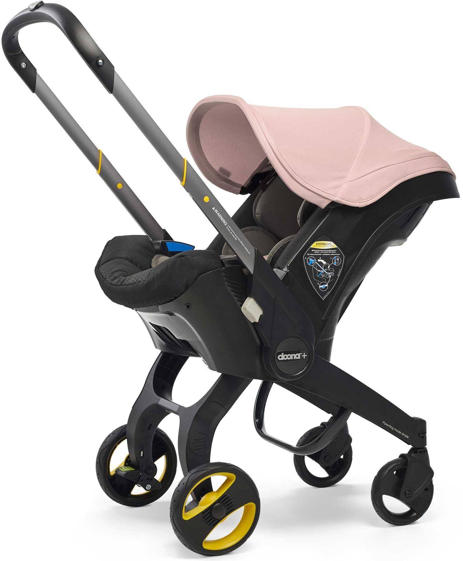 Seggiolino auto per neonati Doona con base rosa cipria