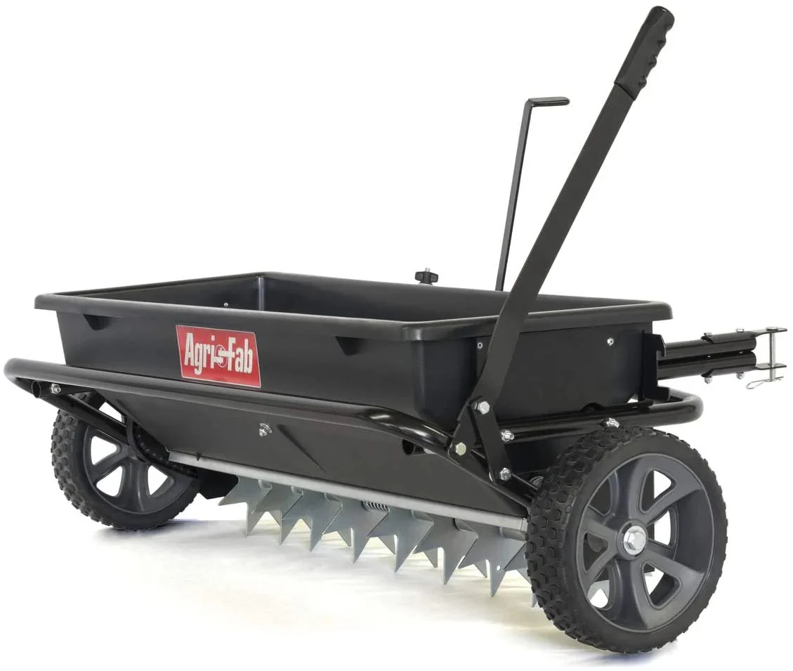 100 lb (approx. 45 kg) trailed lawn and garden spreader/seeder/fertilizer spreader for seeds, fertilizer, salt, road salt; designed to be pulled behind lawn and garden tractors