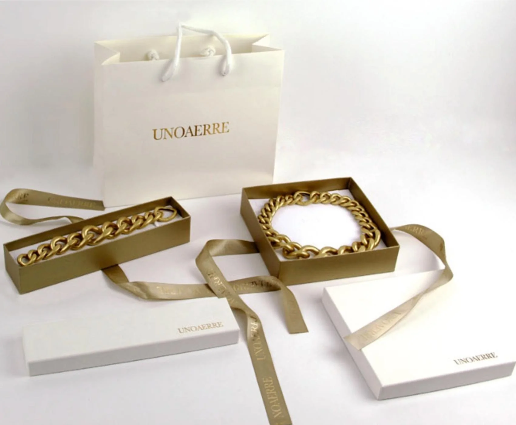 Bracciale Unoaerre 1635 tubo gas elastico a tre fili in bronzo dorato giallo