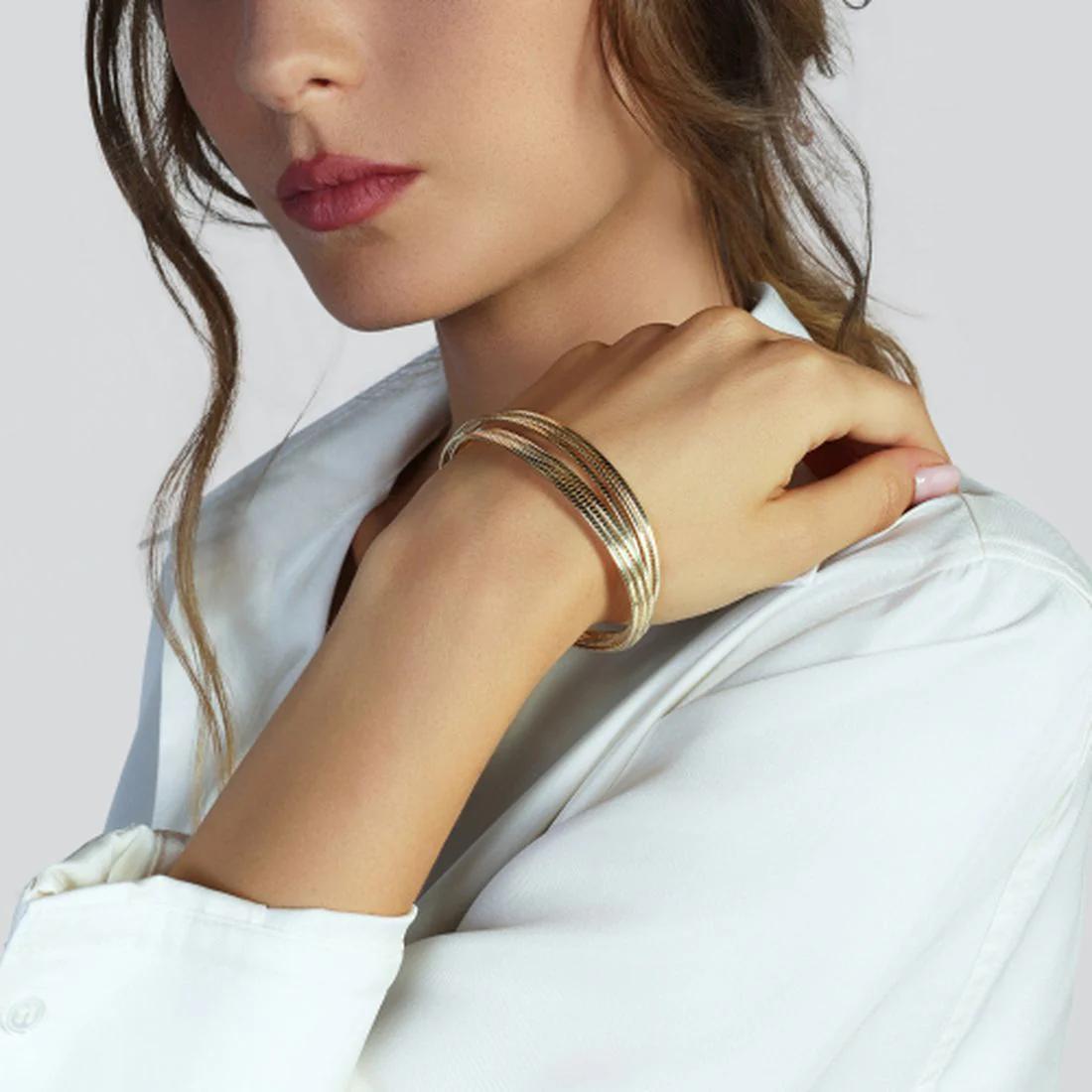 Bracciale Unoaerre in argento dorato rigido a sei fili 6678