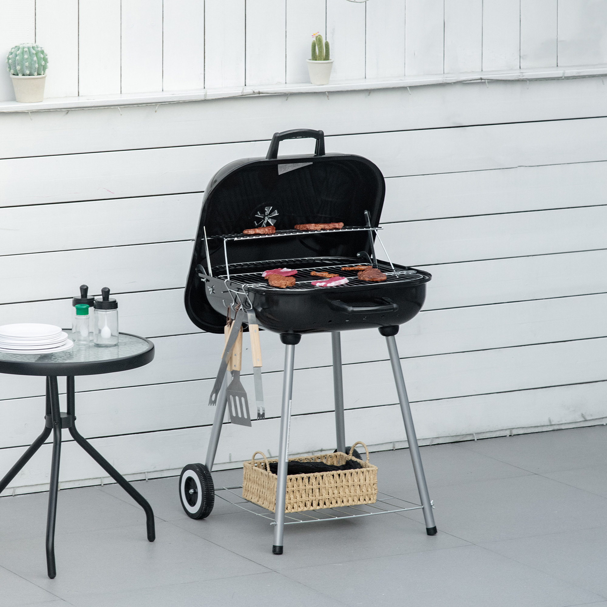 Outsunny Holzkohlegrill BBQ mit 2 Rädern, Kochutensilien, Deckel und Regal Maße 56L x 62B x 82H cm - emailliertes Metall schwarz