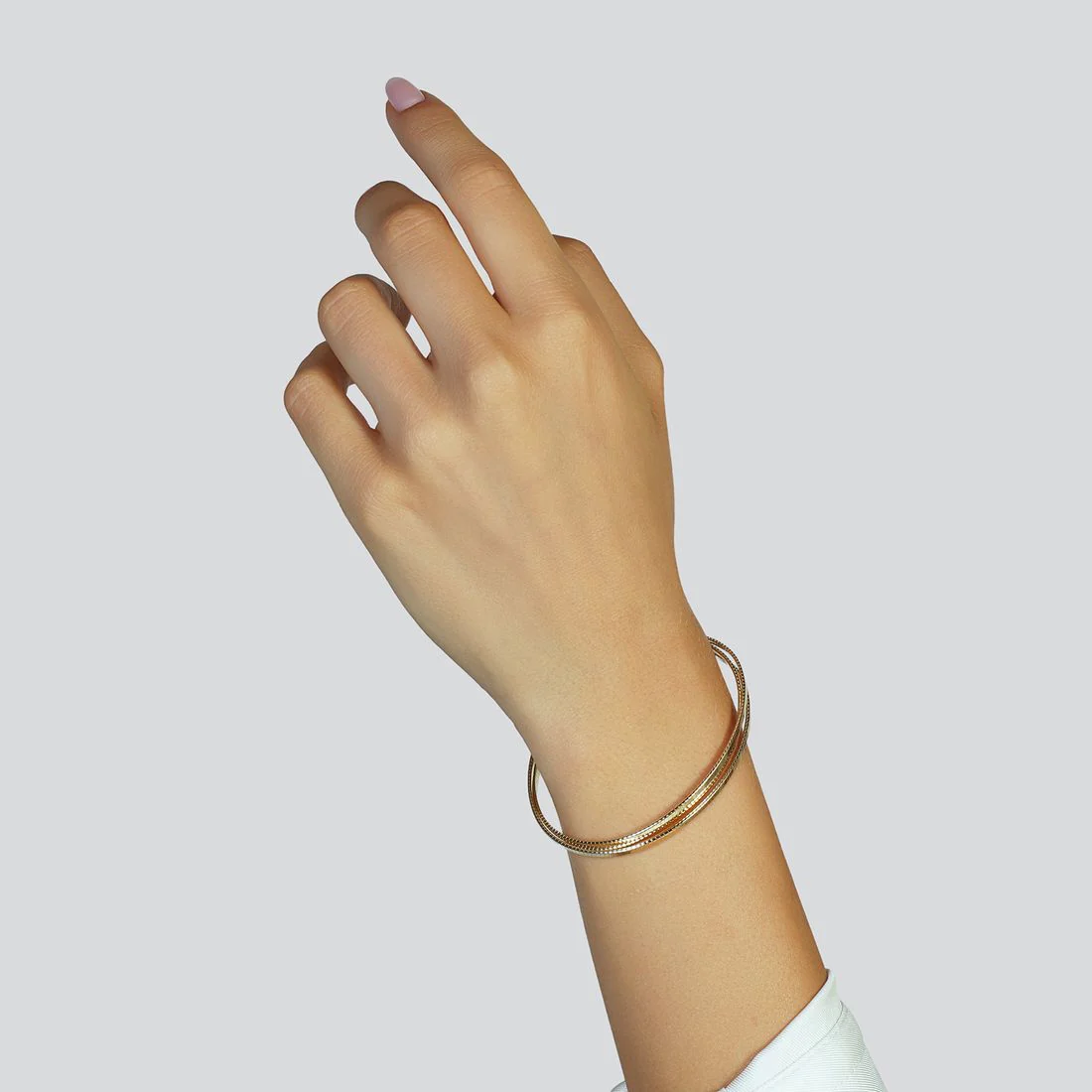 Bracciale Unoaerre in argento dorato rigido a tre fili 6680