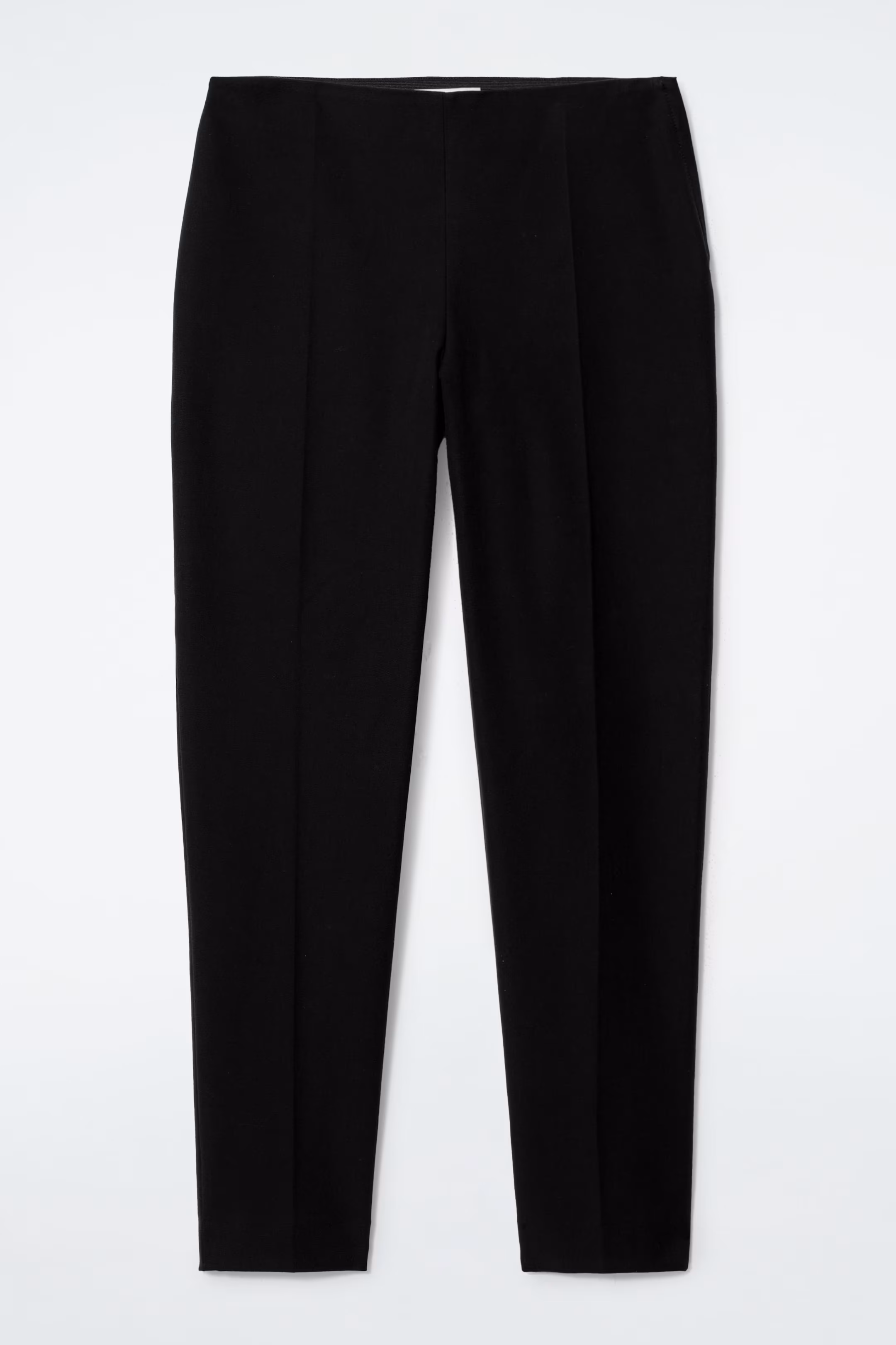 ELONGATED CAPRI TROUSERS