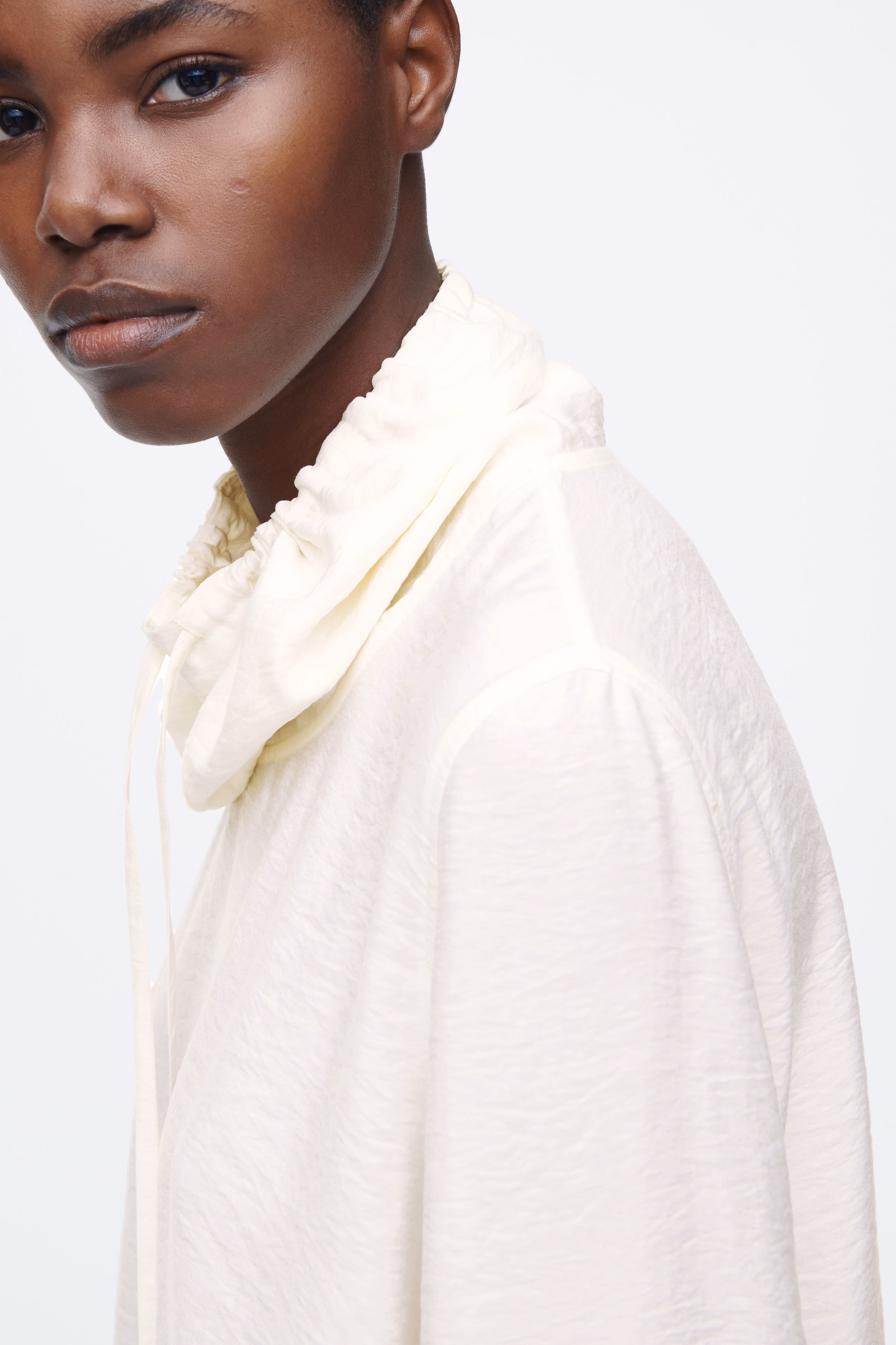 DRAWSTRING FUNNEL-NECK BLOUSE