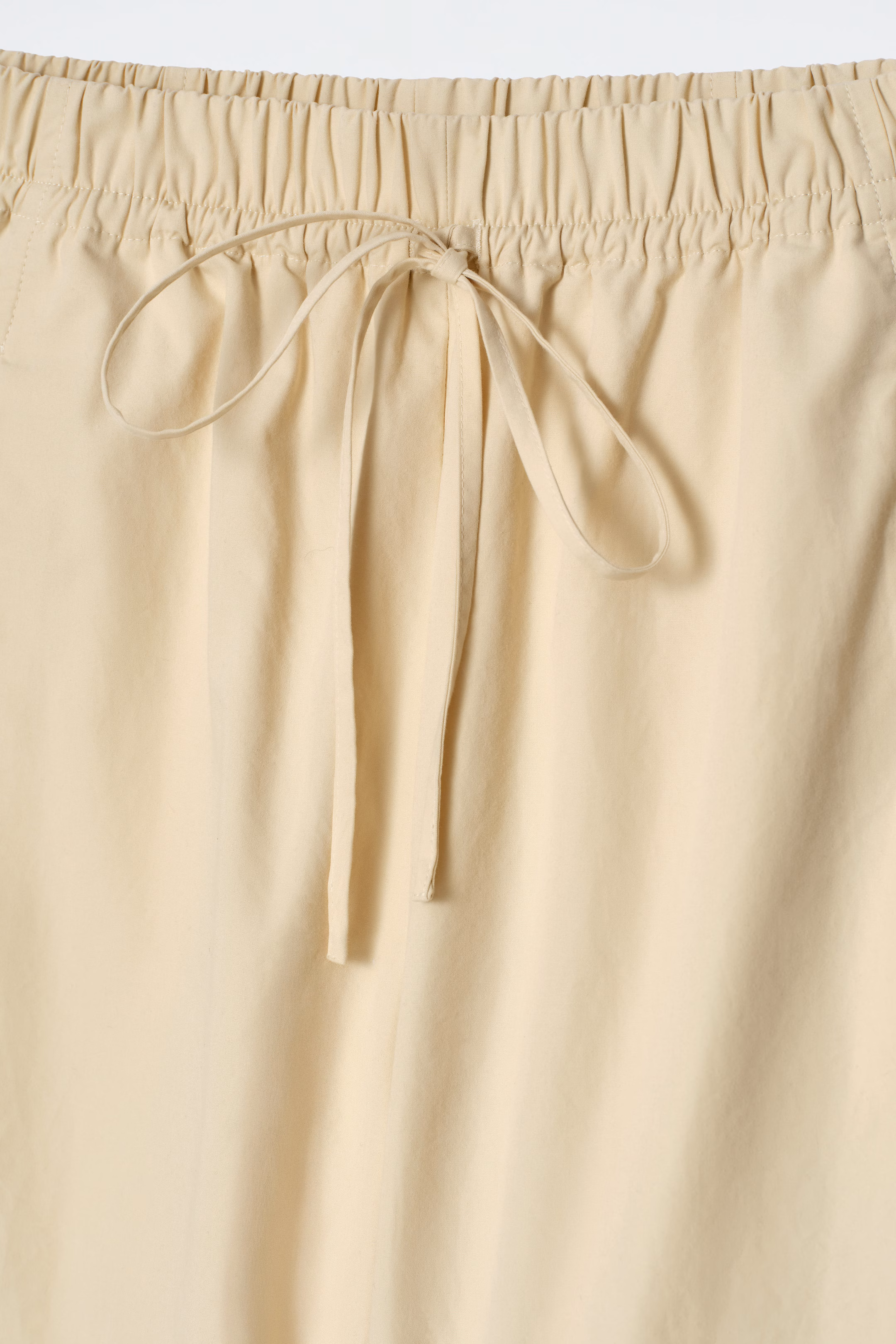 ELASTICATED BARREL-LEG TROUSERS