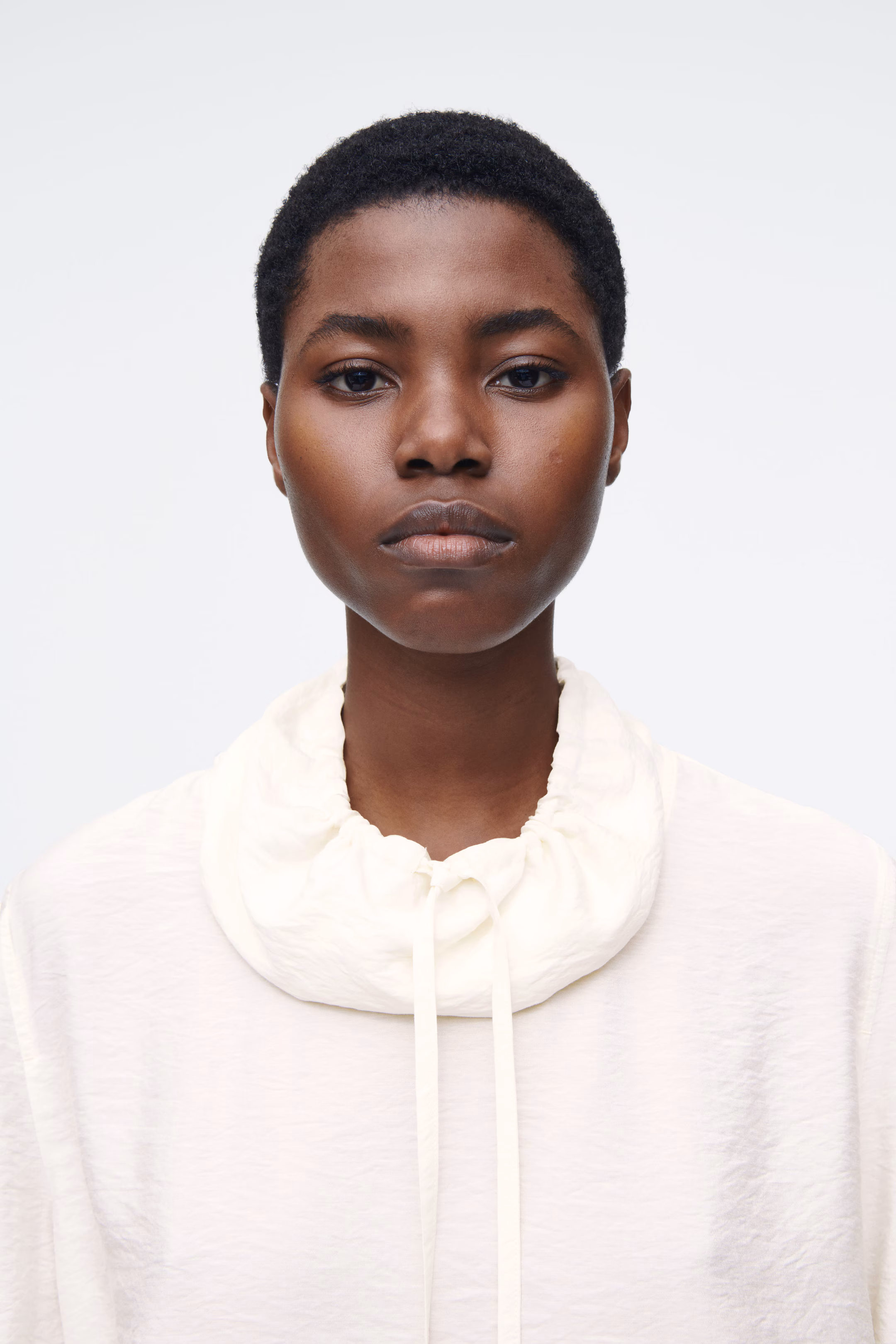 DRAWSTRING FUNNEL-NECK BLOUSE