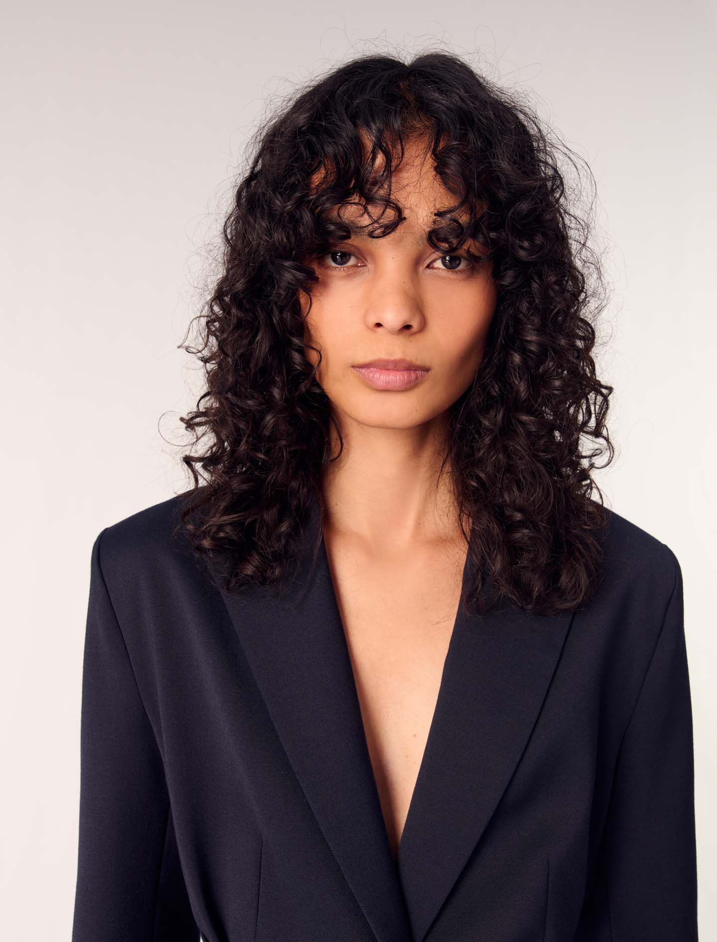 Suit jacket with pleated back