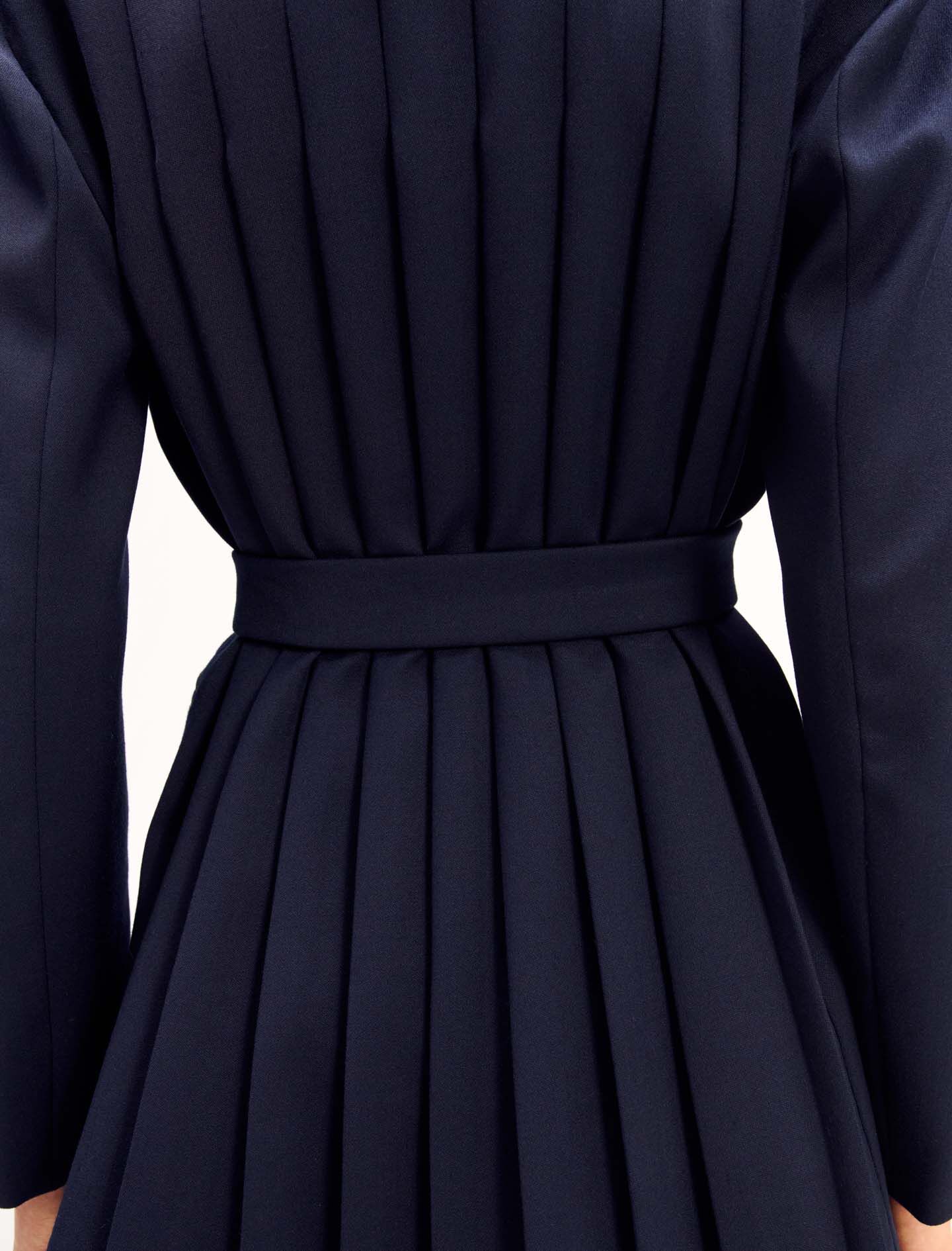 Suit jacket with pleated back