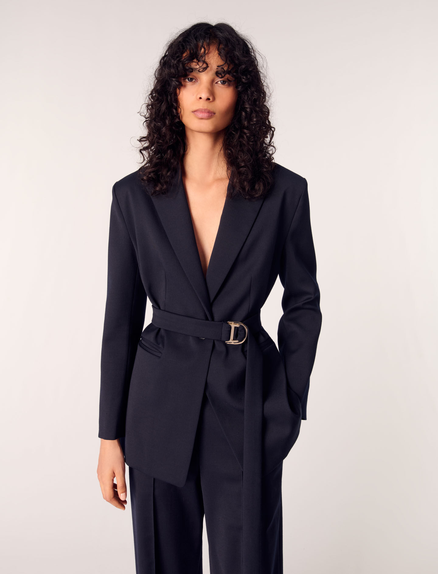 Suit jacket with pleated back
