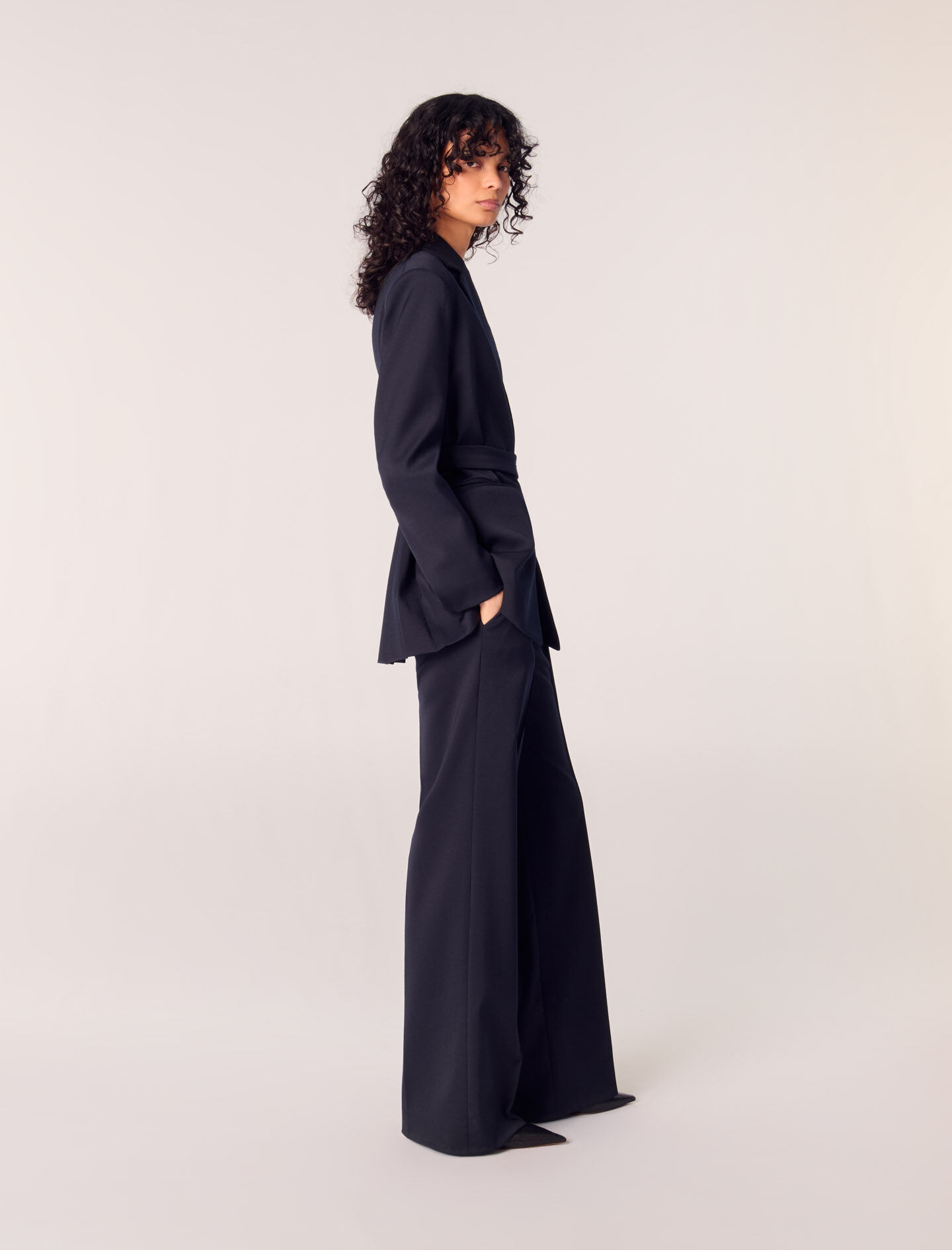 Suit jacket with pleated back