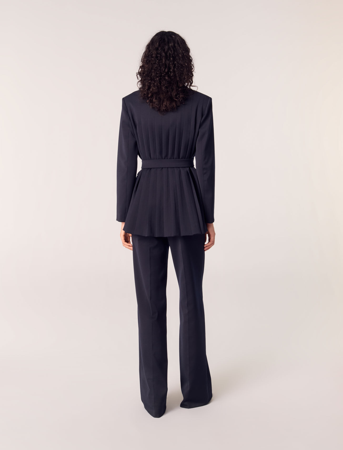 Suit jacket with pleated back