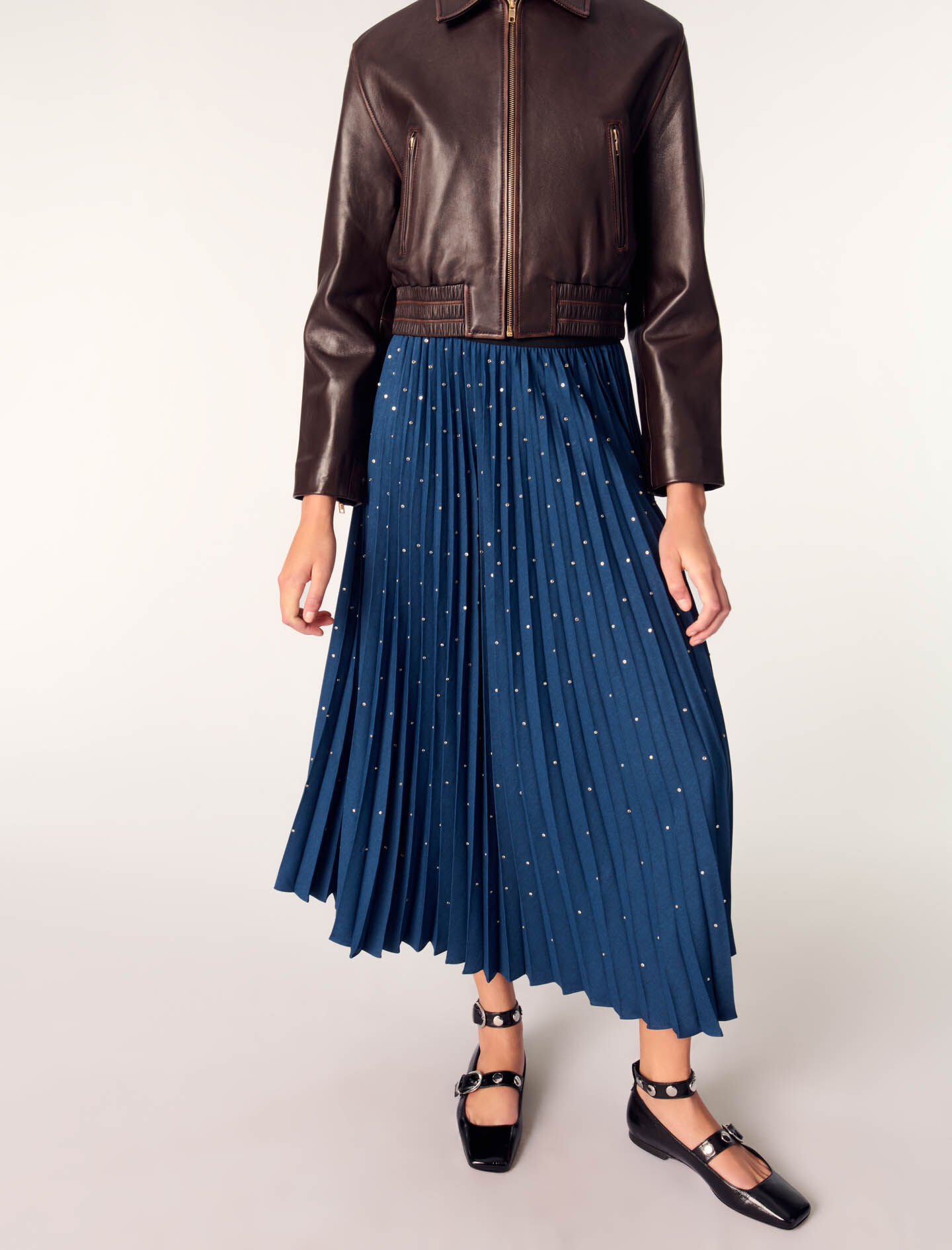 Long pleated skirt with studs