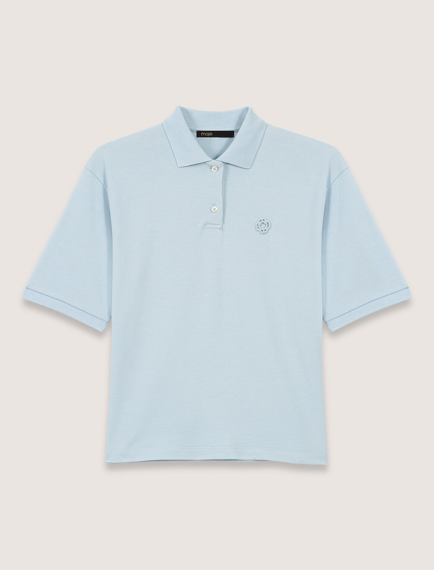 Polo shirt with logo patch