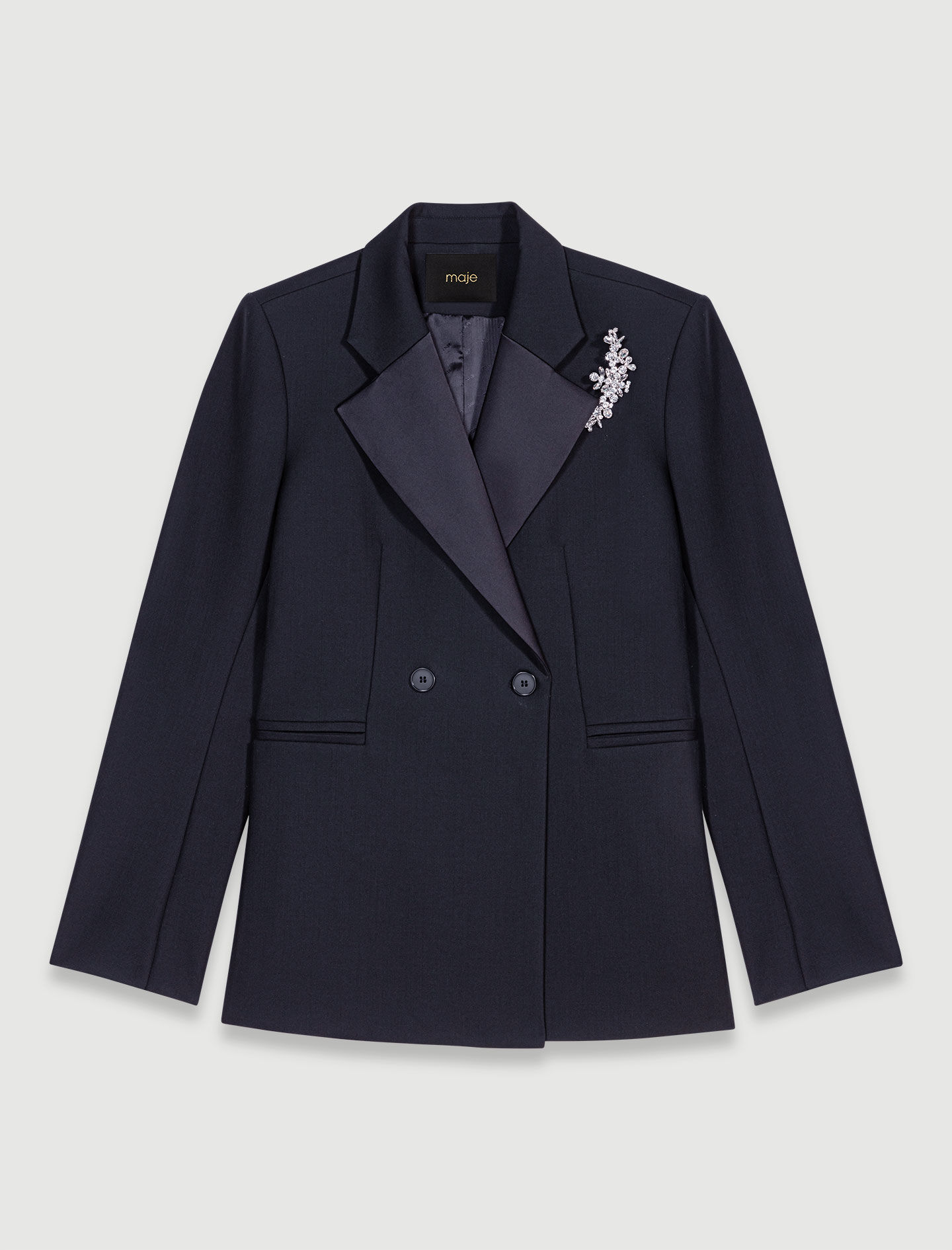 Suit jacket with brooch