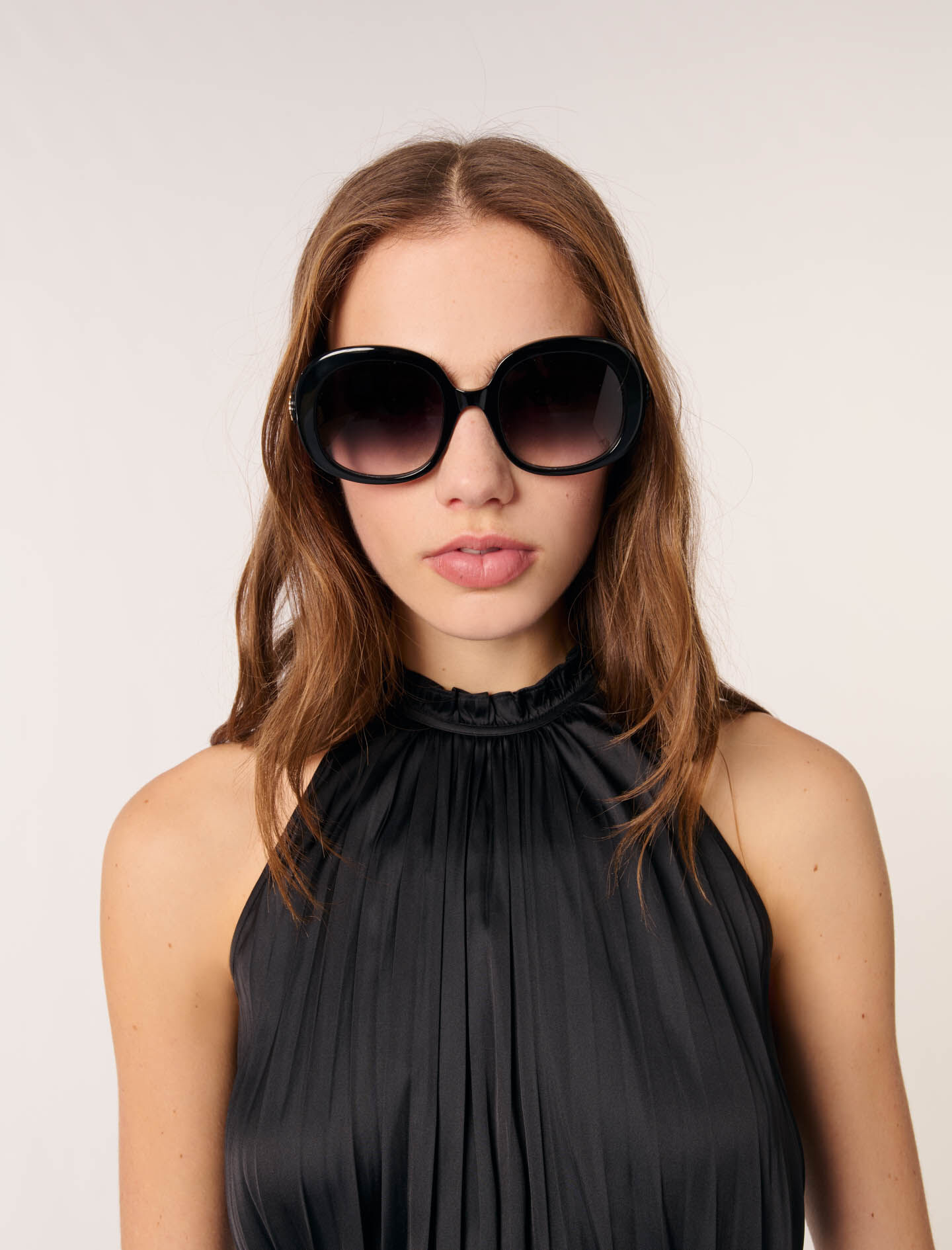 Sleeveless pleated top