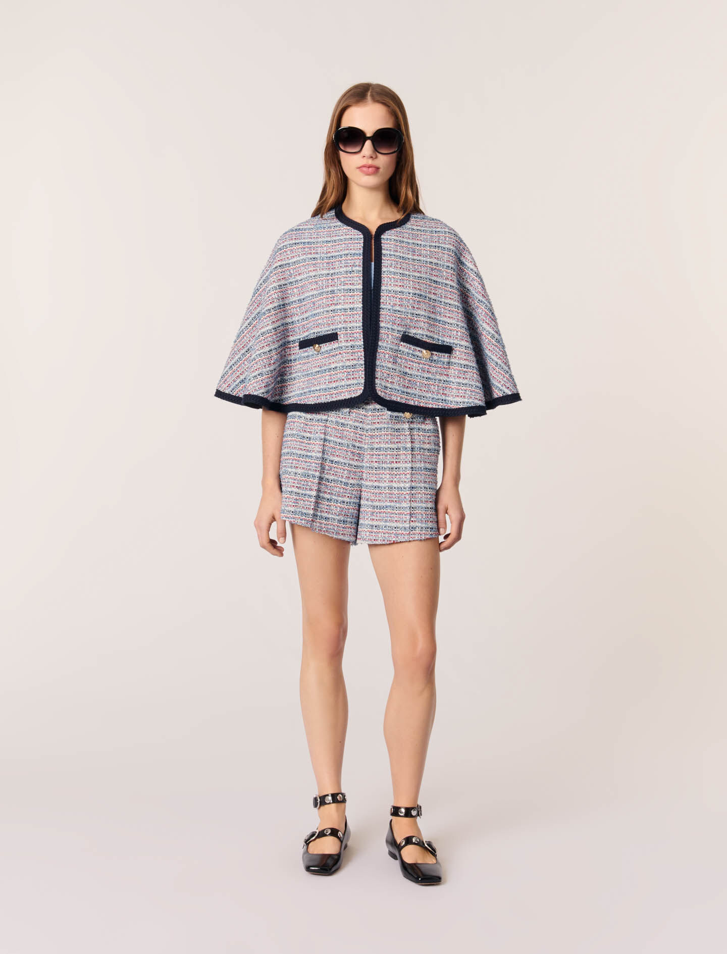 Tweed cape with contrasting trim