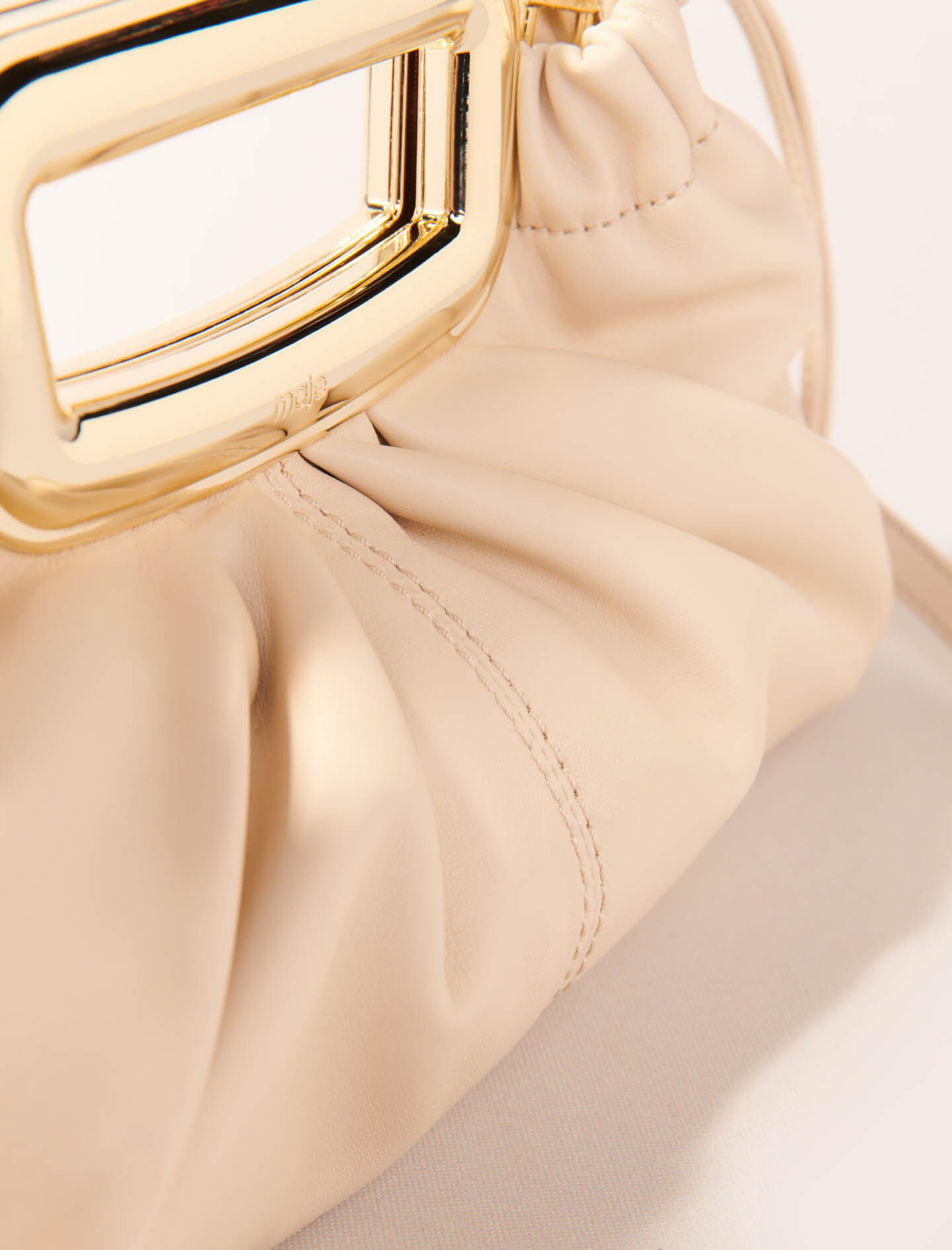 Metal handle leather clutch