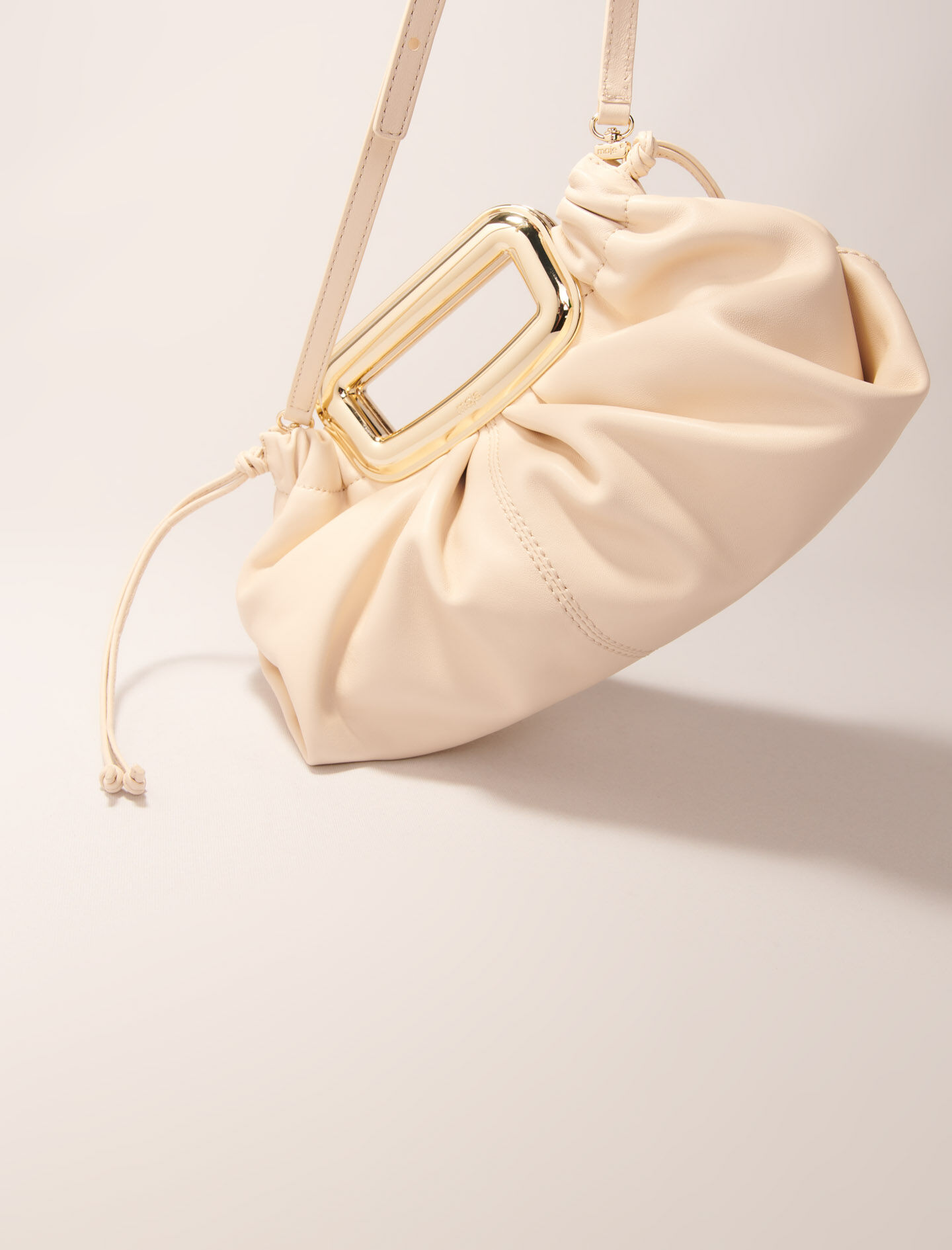 Metal handle leather clutch