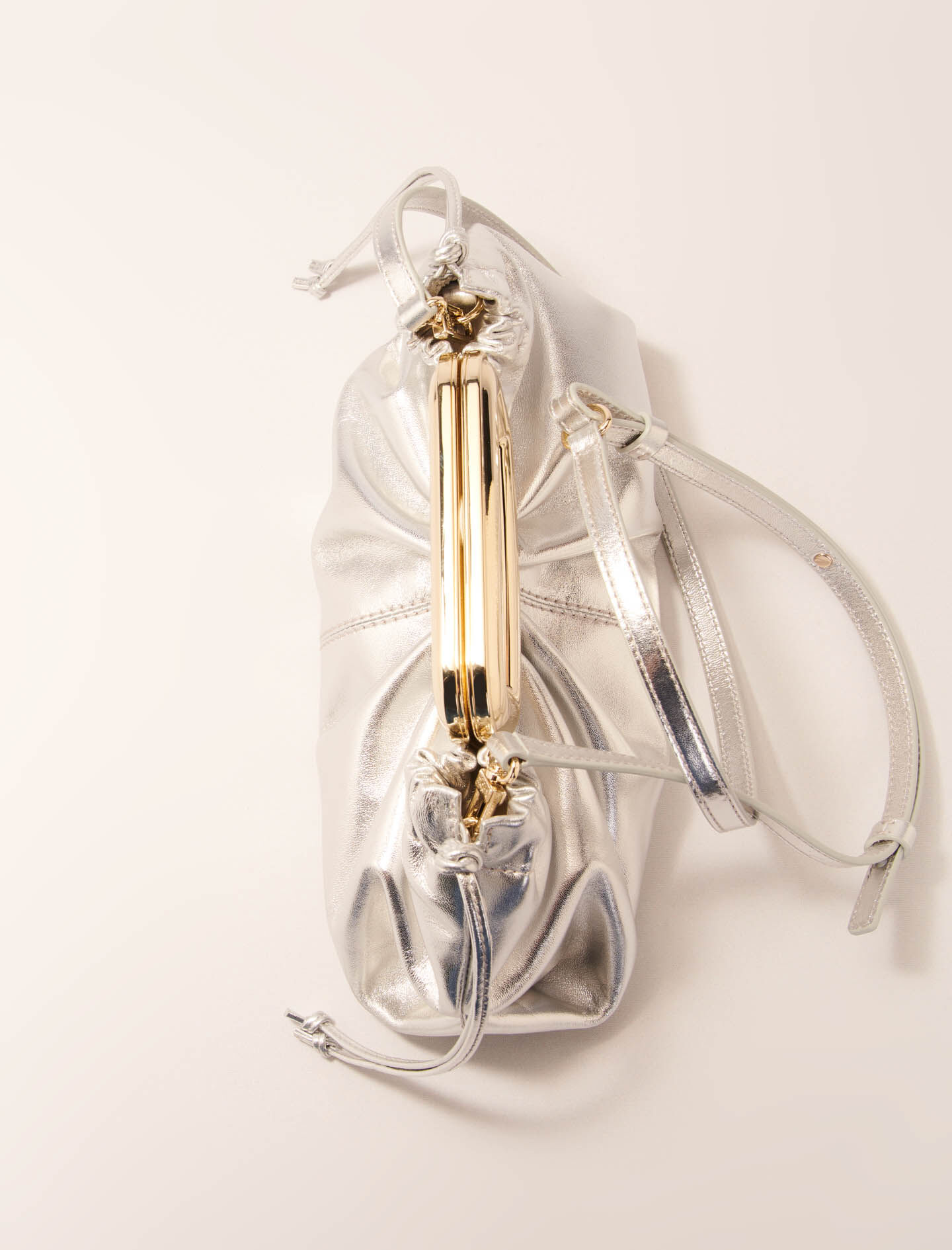 Metal handle leather clutch