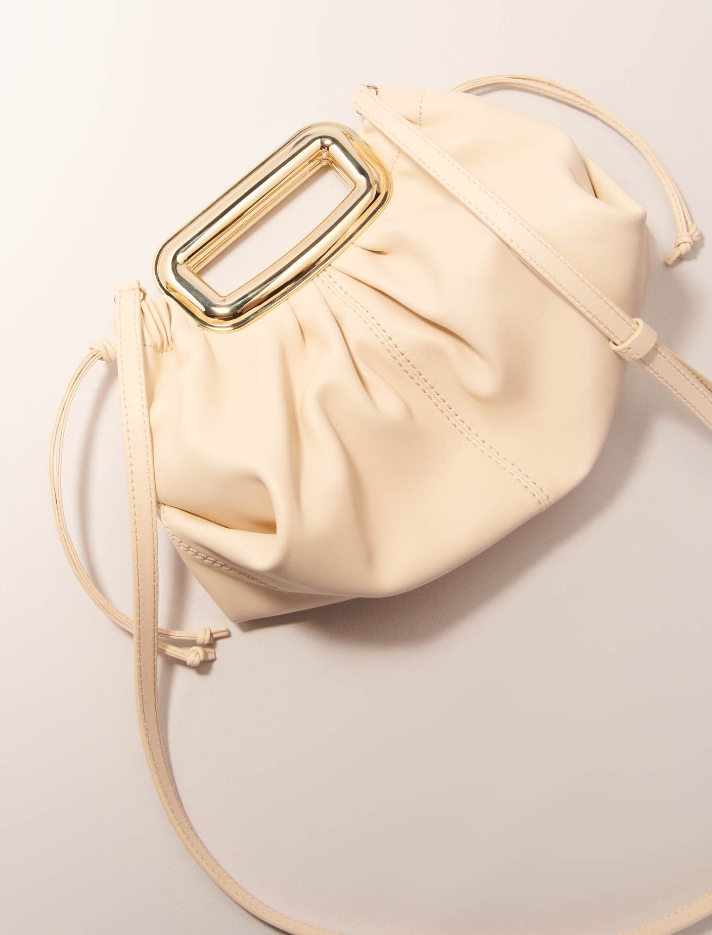 Metal handle leather clutch