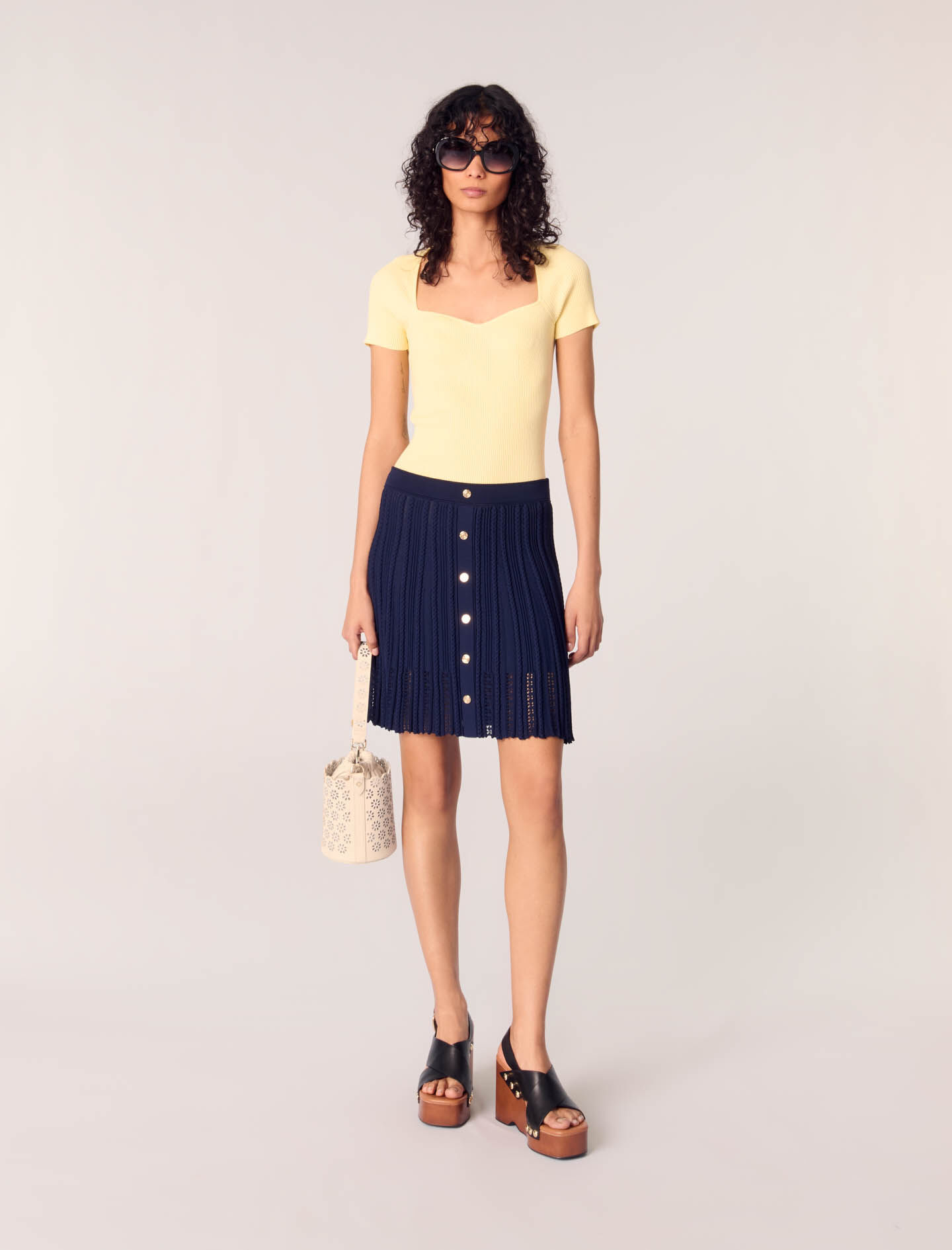 Perforated leather bucket bag