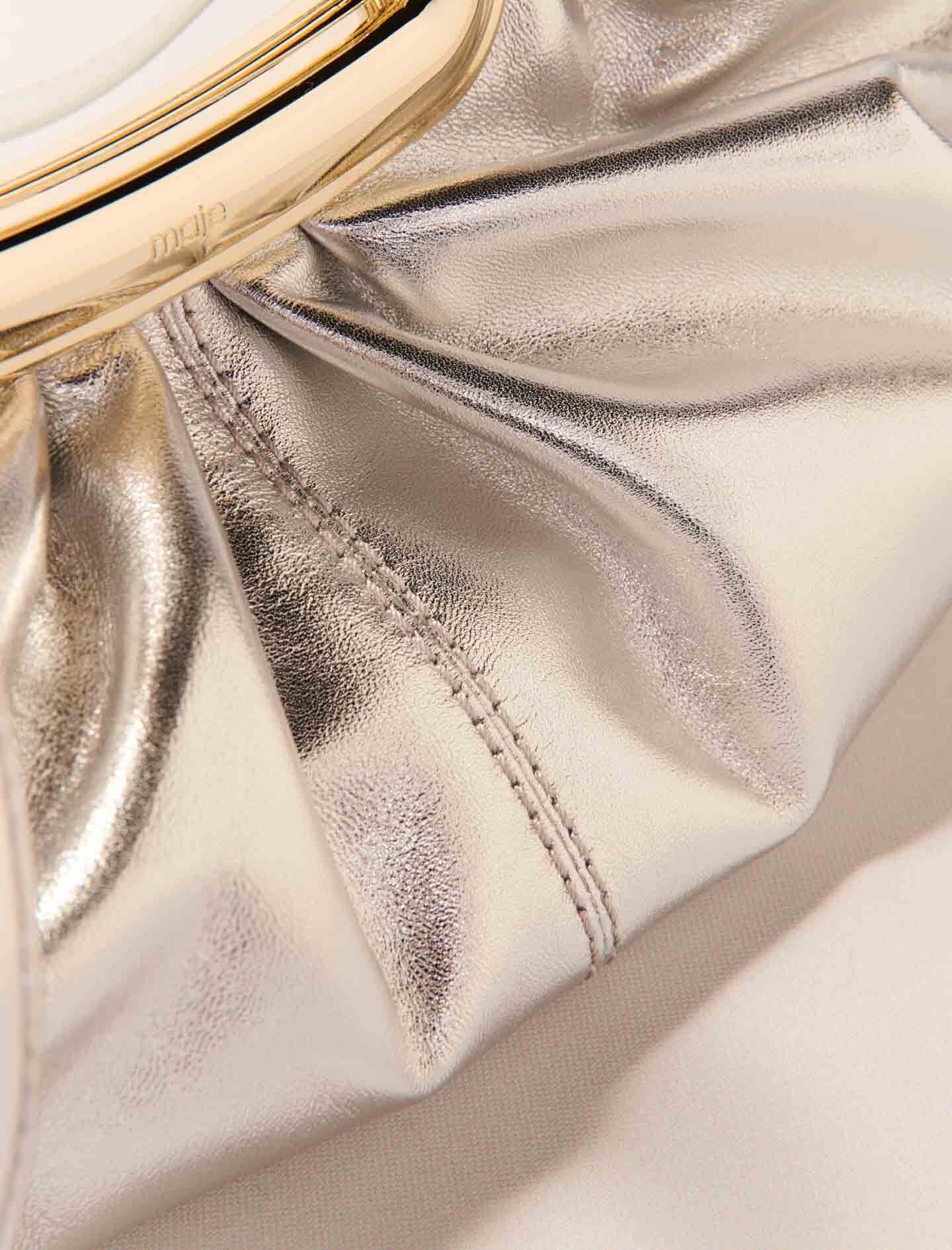 Metal handle leather clutch