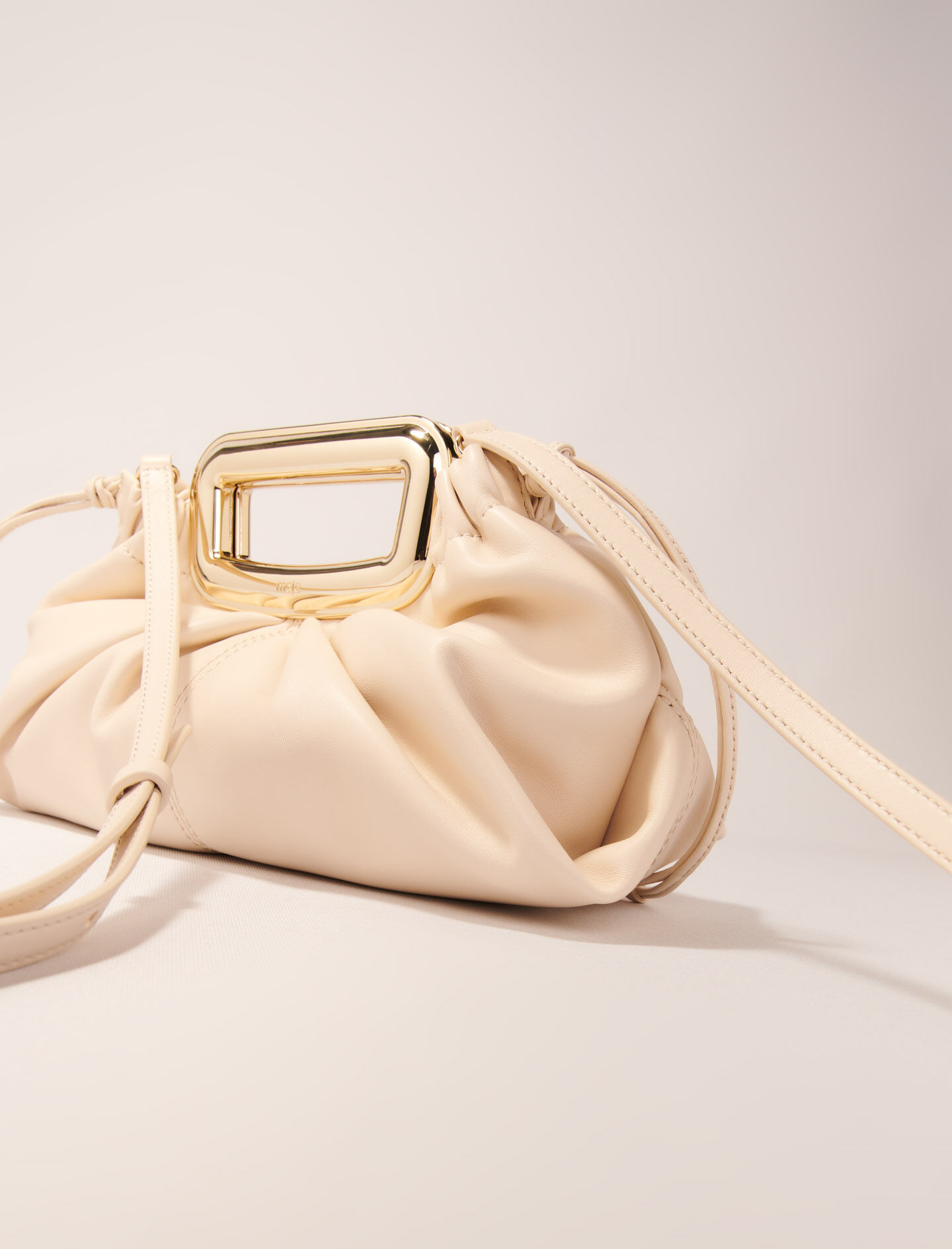 Metal handle leather clutch