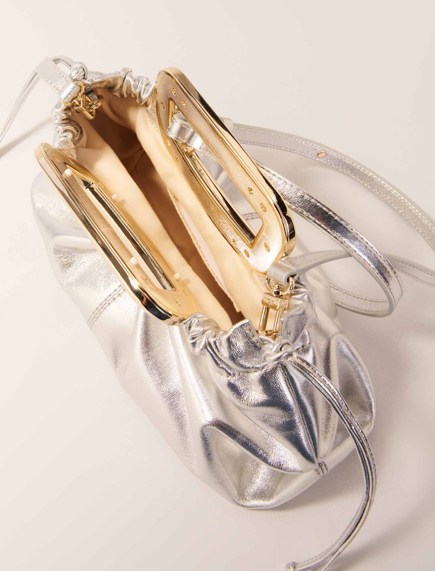 Metal handle leather clutch