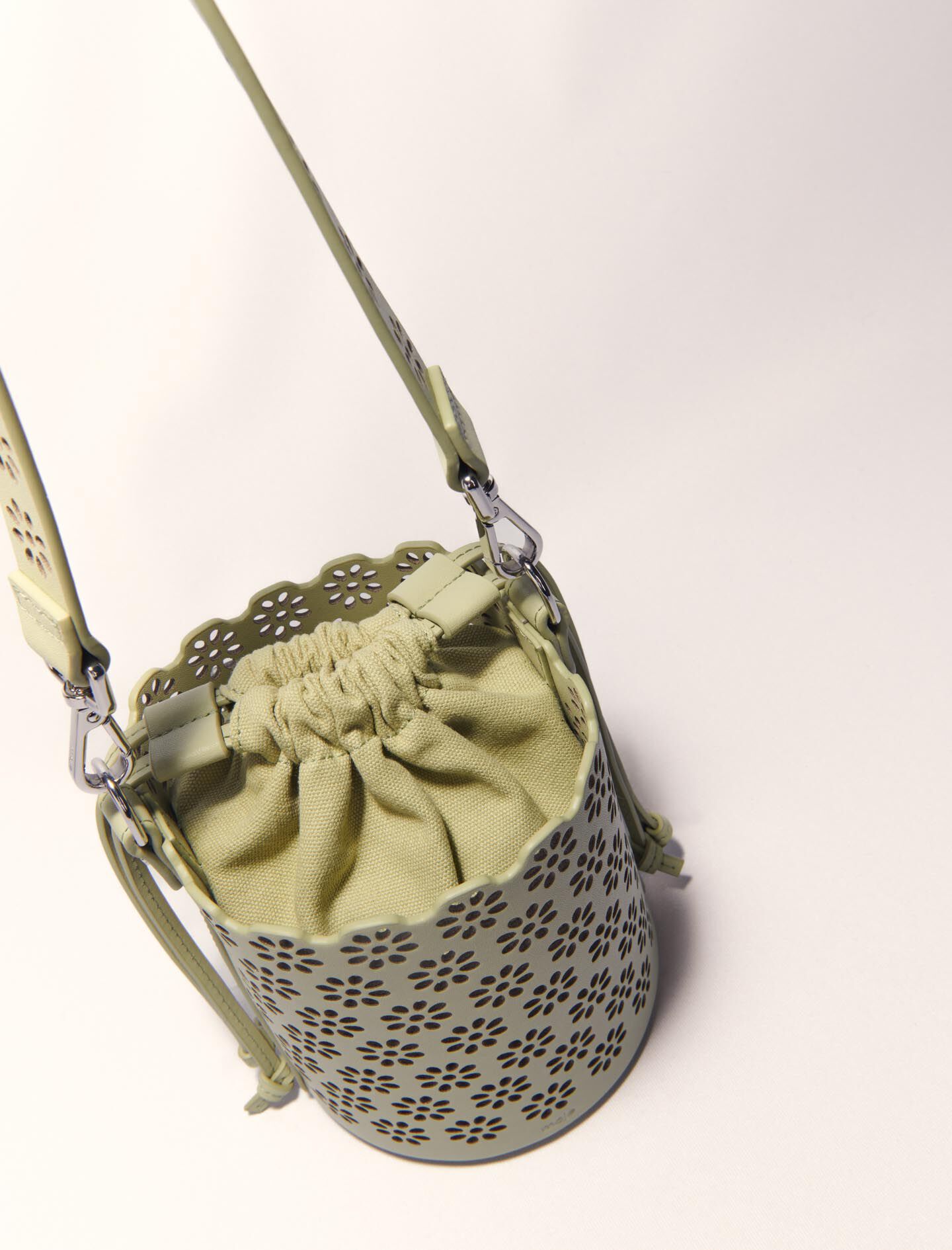 Perforated leather bucket bag