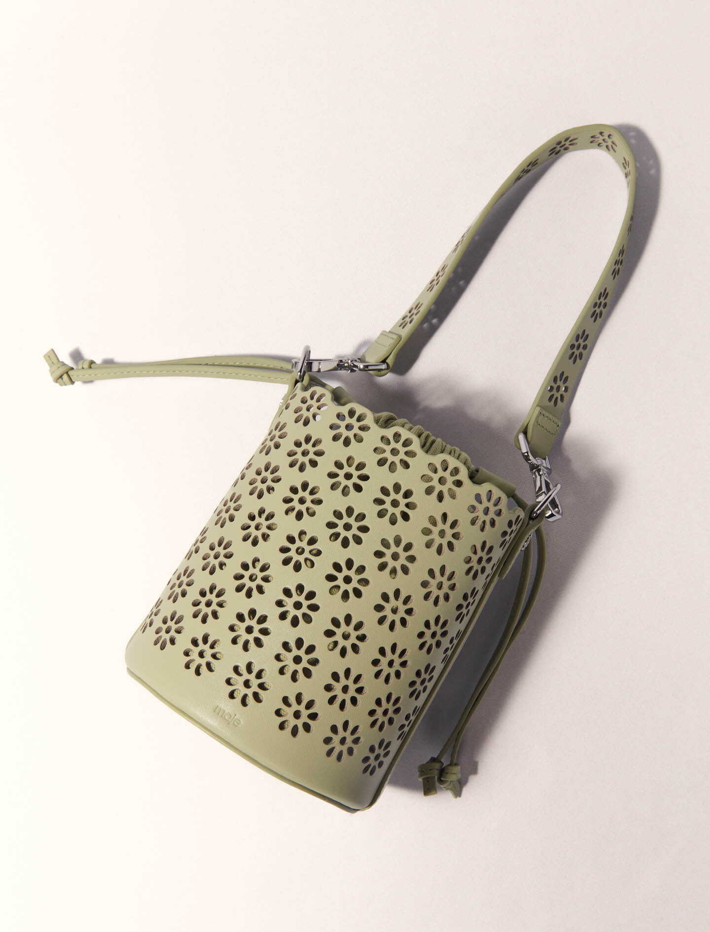 Perforated leather bucket bag