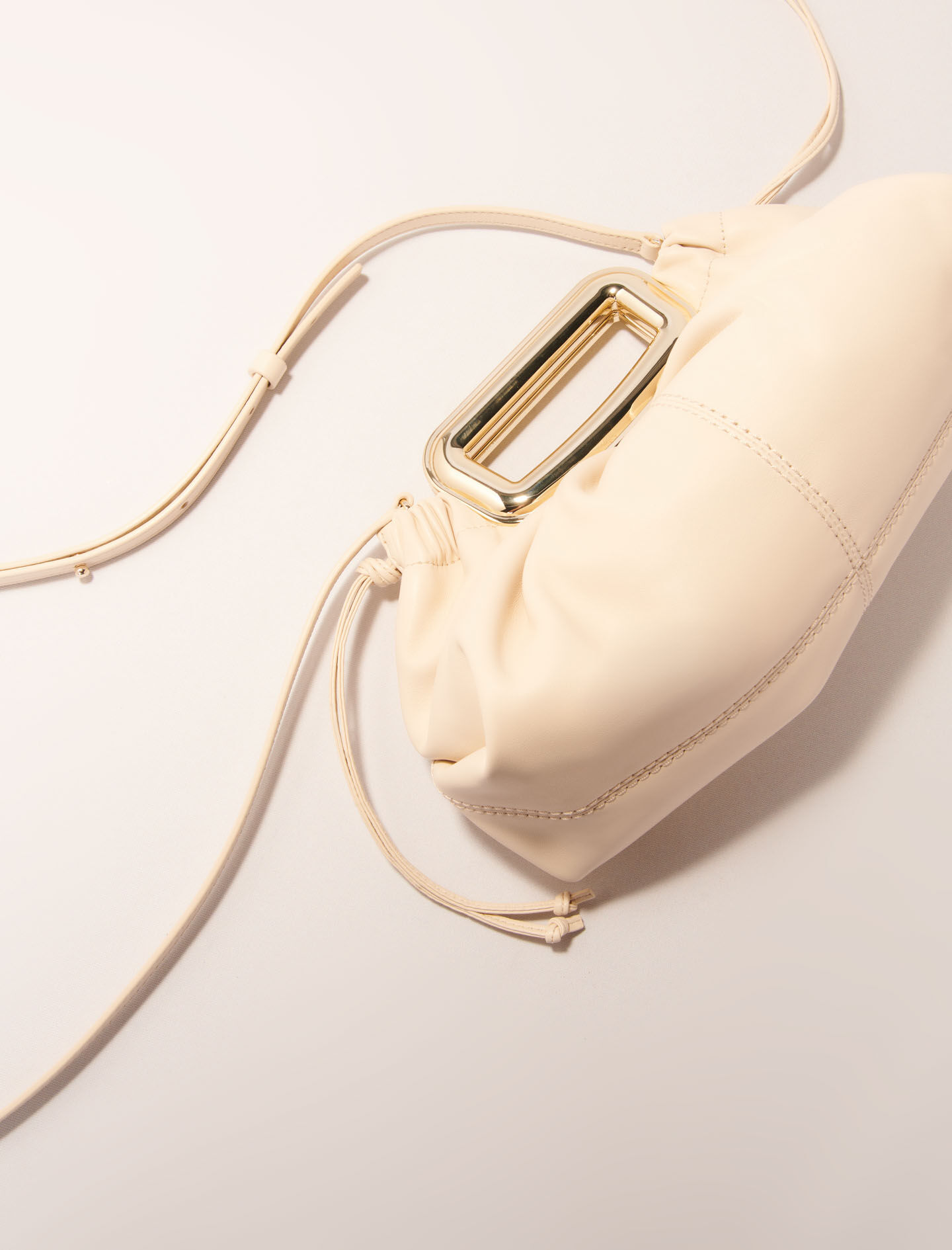 Metal handle leather clutch