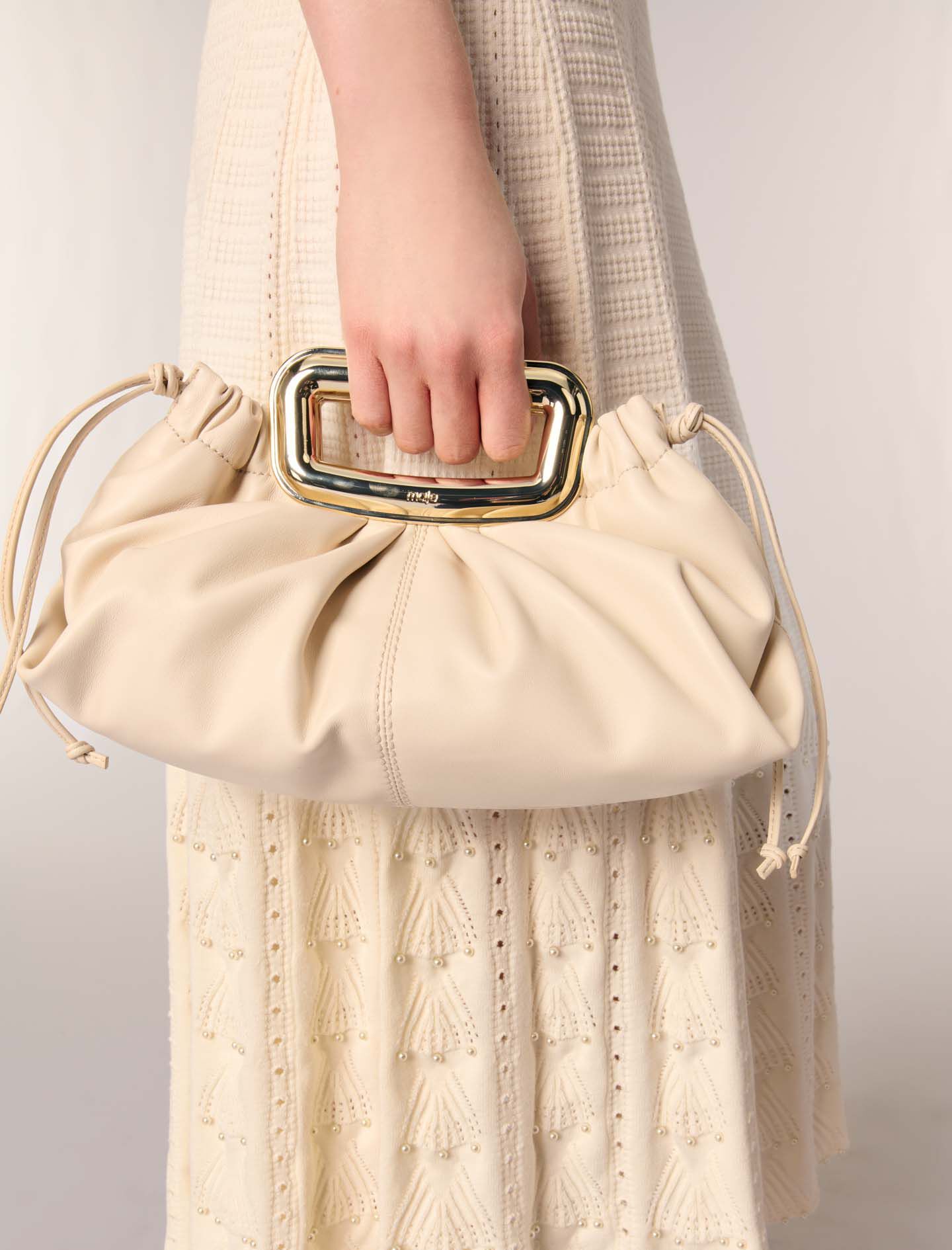 Metal handle leather clutch