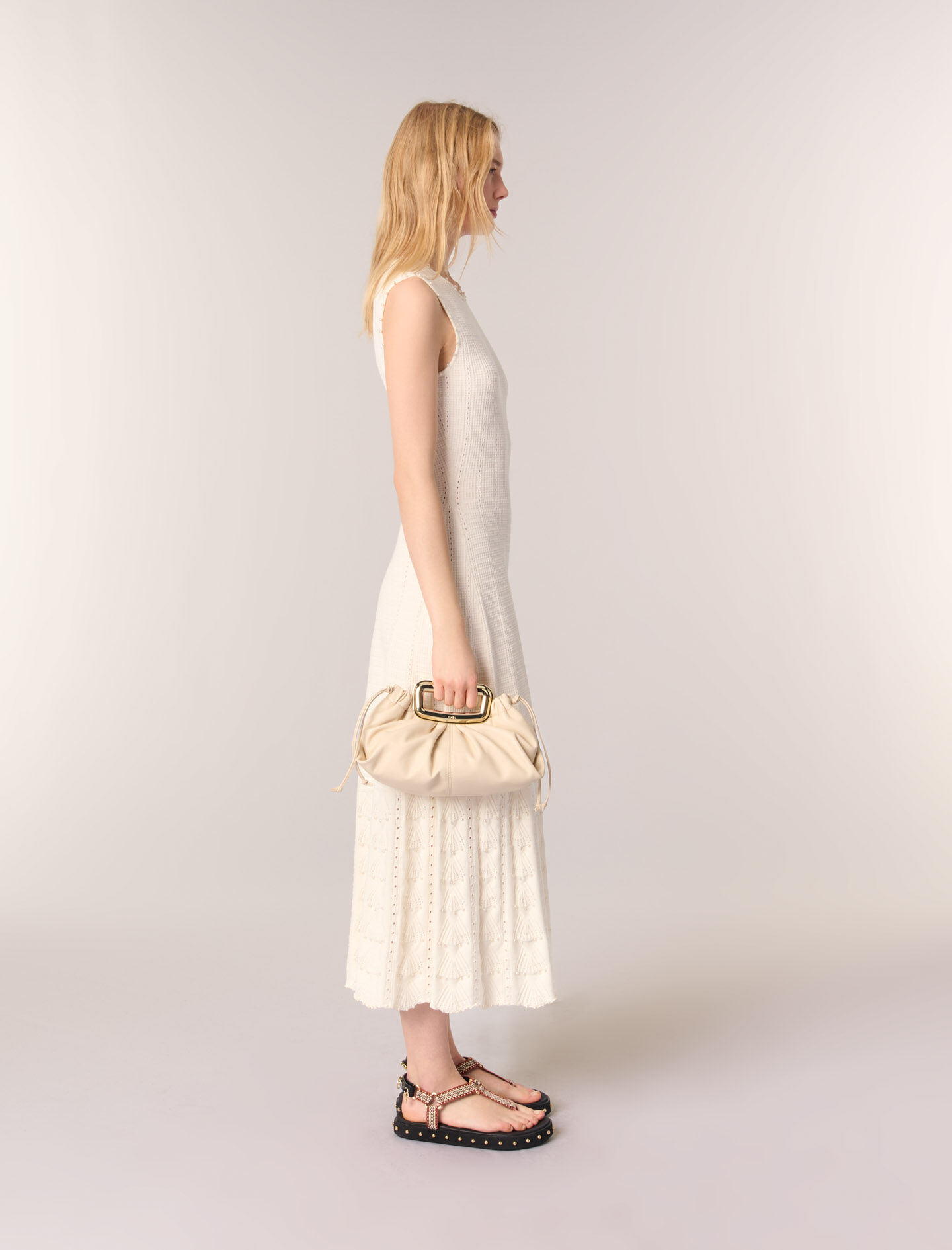 Metal handle leather clutch