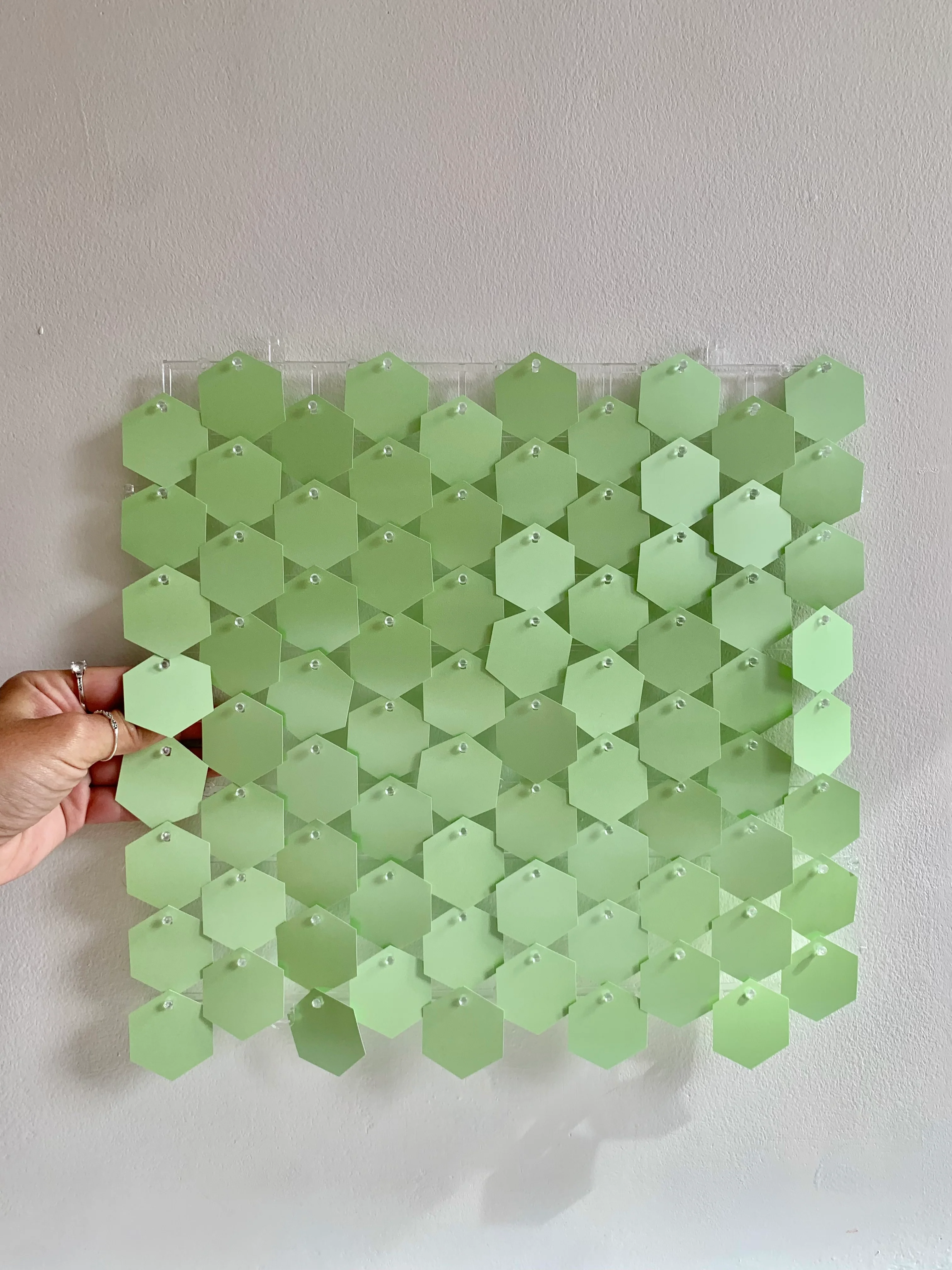 New pearlescent pastel green hexagonal sequin wall