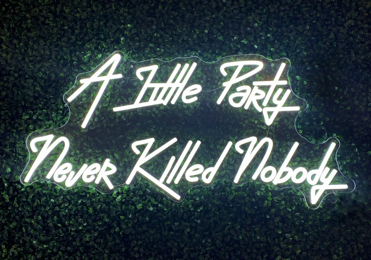 “A little party never killed nobody” neon sign in cool white 89cm x 43cm