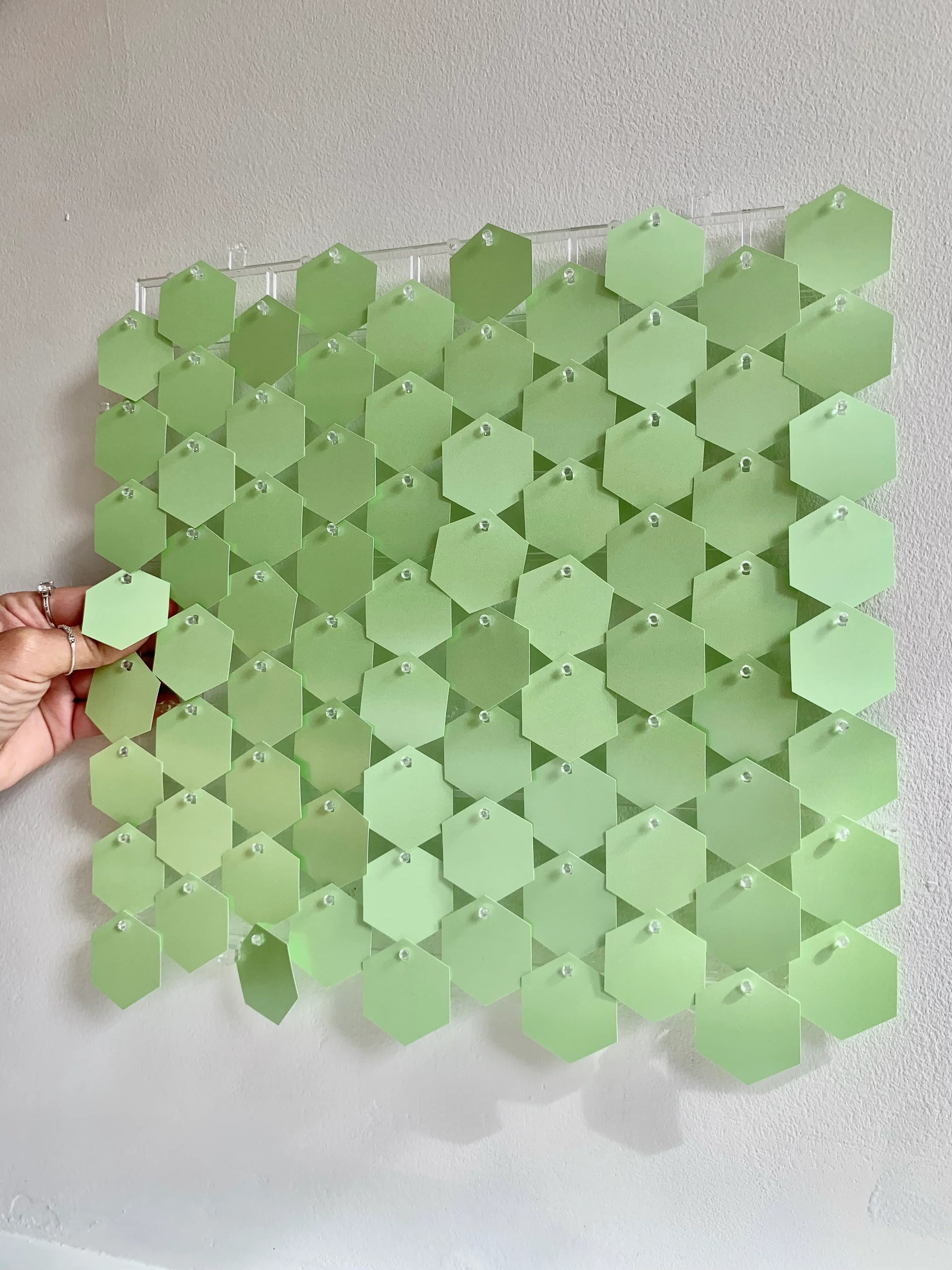 New pearlescent pastel green hexagonal sequin wall