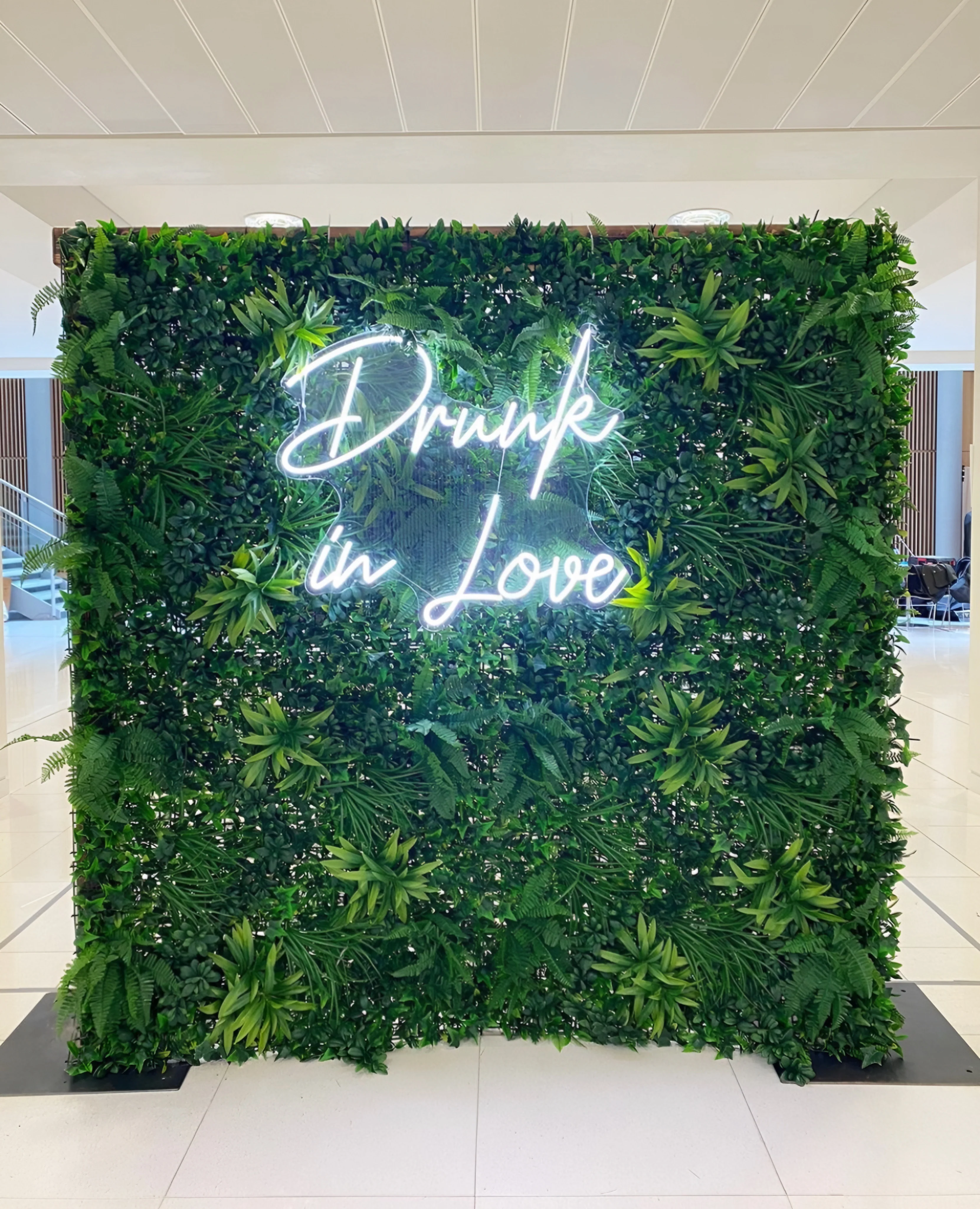 Neon “DRUNK IN LOVE” sign in cool white